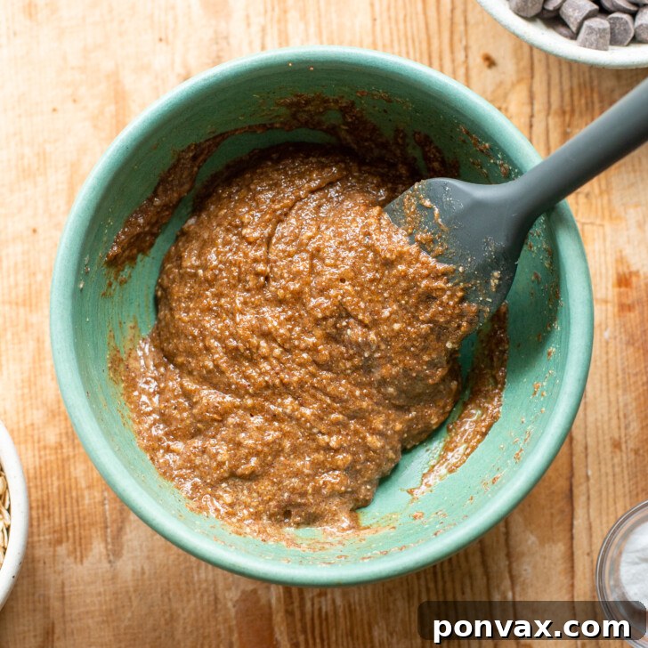 Gluten-Free Oatmeal Chocolate Chip Skillet Delight 9 Image showing the final smooth mixture of wet ingredients.