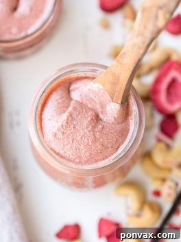 Homemade Strawberry Cashew Butter, a Paleo, vegan, sugar-free, and Whole30-friendly treat. A vibrant pink spread.
