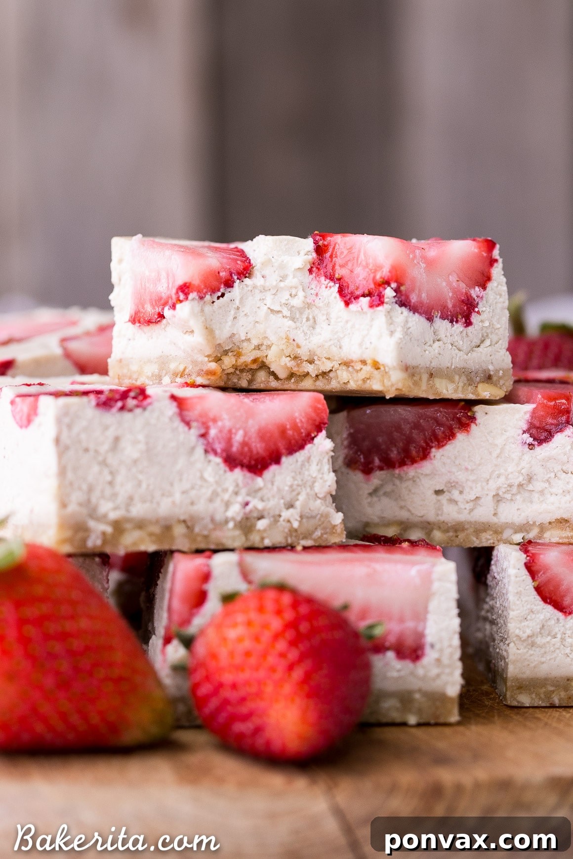 A close-up of the delectable No-Bake Vegan Strawberry Shortcake Bars, showcasing their creamy texture, vibrant strawberry topping, and sturdy gluten-free base.