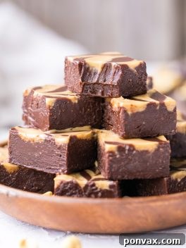 This Easy Chocolate Peanut Butter Fudge is made with just four wholesome ingredients! This refined sugar free and vegan fudge is incredibly smooth, creamy, and melts in your mouth.