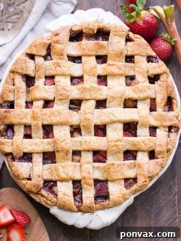 This Paleo Strawberry Rhubarb Pie is bursting with fresh strawberries and rhubarb, creating a delectable tart + sweet pie! The crisp and flaky gluten-free + grain-free crust is the perfect vessel for the lightly spiced fruit filling.
