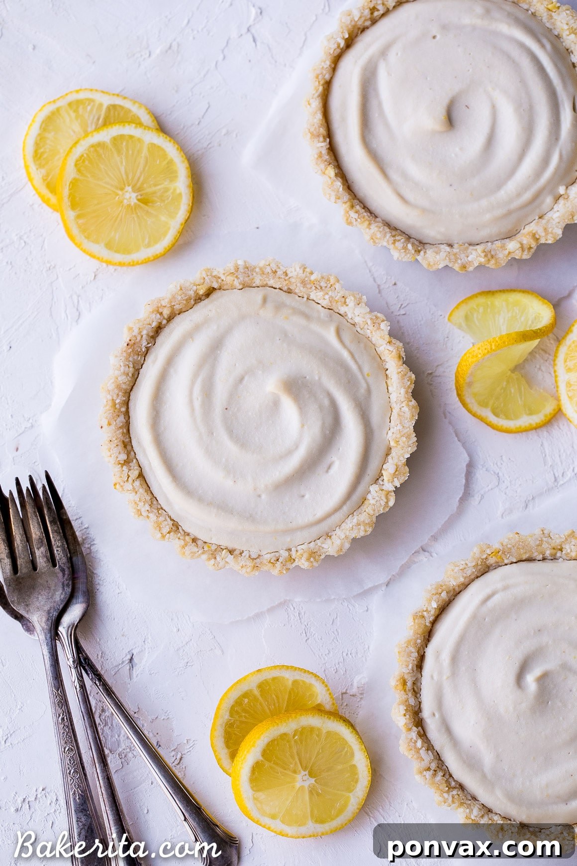 Creamy Vegan No-Bake Lemon Tarts 2 Delicious and easy No-Bake Lemon Tarts with a tart lemon filling and a lemony cashew coconut crust, perfect for warm days.