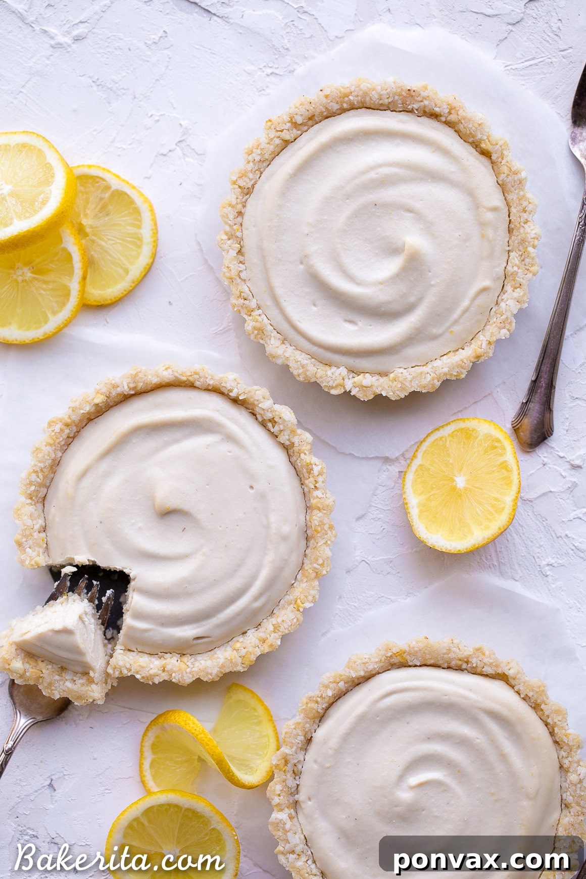 Creamy Vegan No-Bake Lemon Tarts 3 Close-up of a creamy No-Bake Lemon Tart, showcasing its vibrant yellow filling and rustic cashew coconut crust.