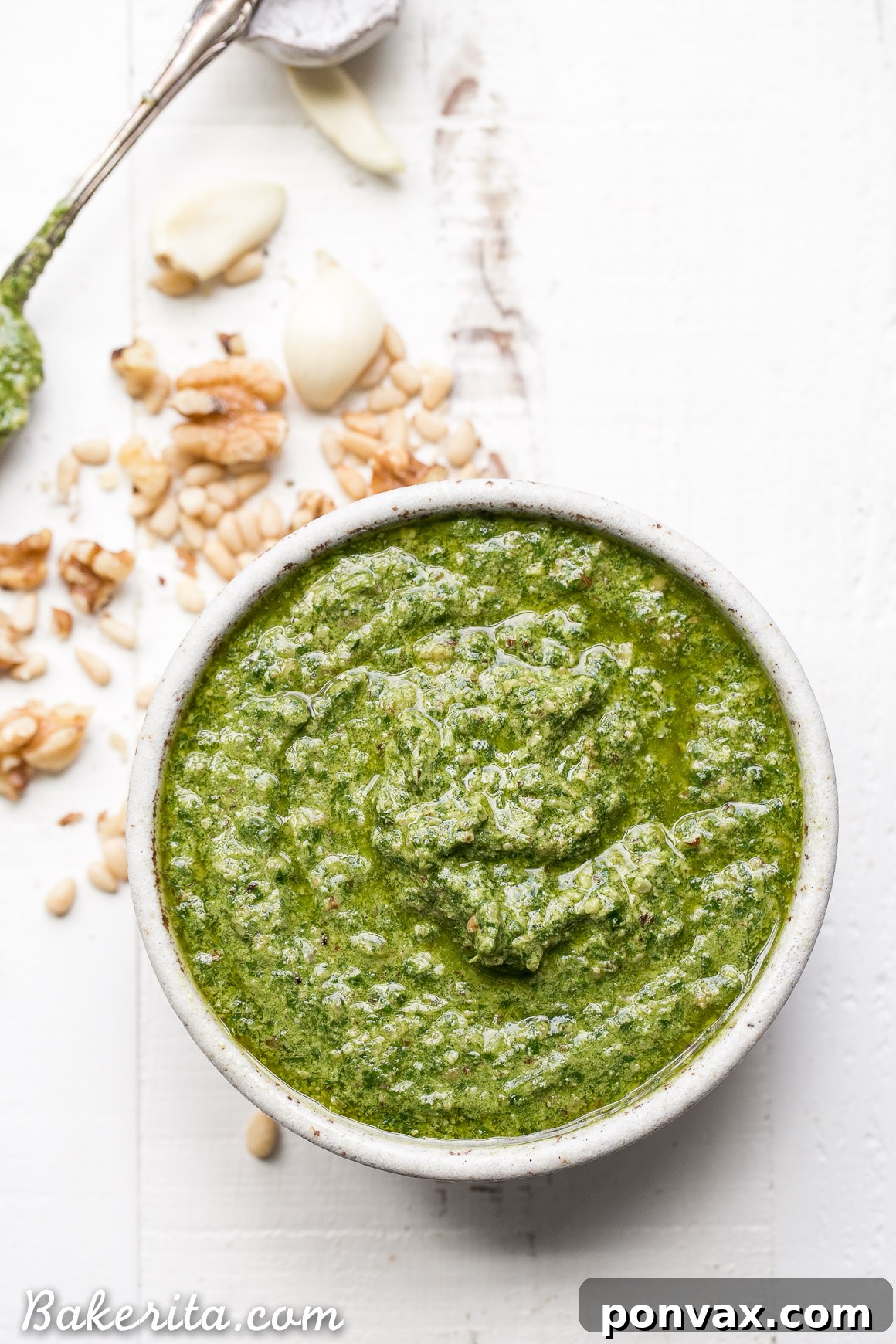 This Spinach Basil Pesto is loaded with bright herby flavor and made in just a few minutes. You won't miss the cheese in this paleo, vegan + Whole30-friendly pesto. It will make any meal more flavorful, whether it's tossed with pasta, enjoyed with your favorite protein, or used as a spread.