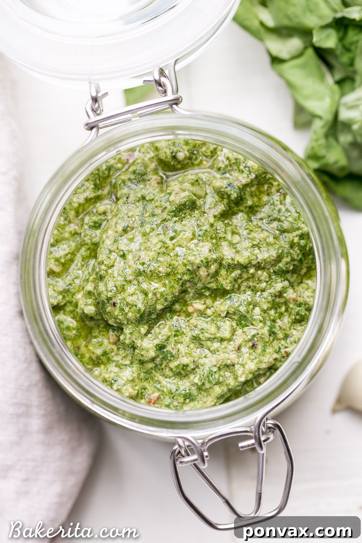This Spinach Basil Pesto is loaded with bright herby flavor and made in just a few minutes. You won't miss the cheese in this paleo, vegan + Whole30-friendly pesto. It will make any meal more flavorful, whether it's tossed with pasta, enjoyed with your favorite protein, or used as a spread.