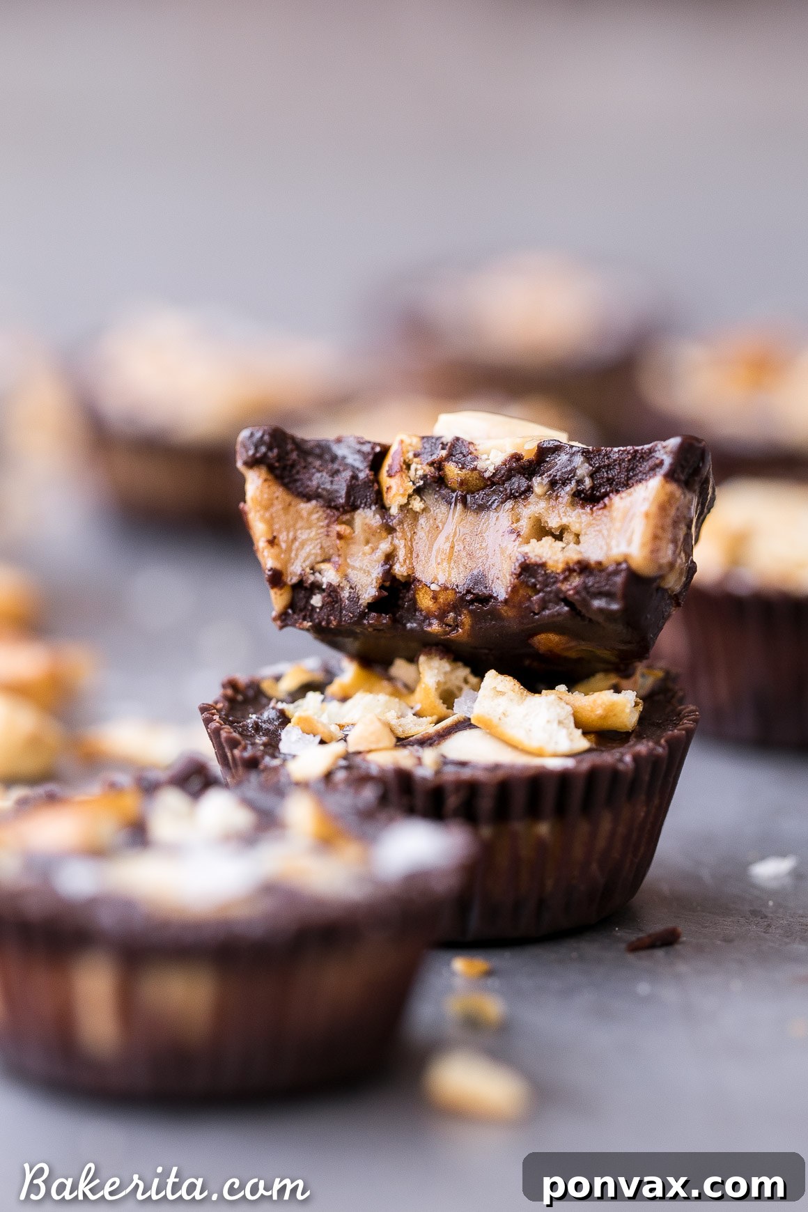 Better Than Take 5 Peanut Butter Pretzel Cups 2 Delicious homemade Chocolate Pretzel Peanut Butter Cups, a gluten-free and vegan alternative to the Take 5 candy bar, showcasing the top layer with pretzels, peanuts, and flaky sea salt.