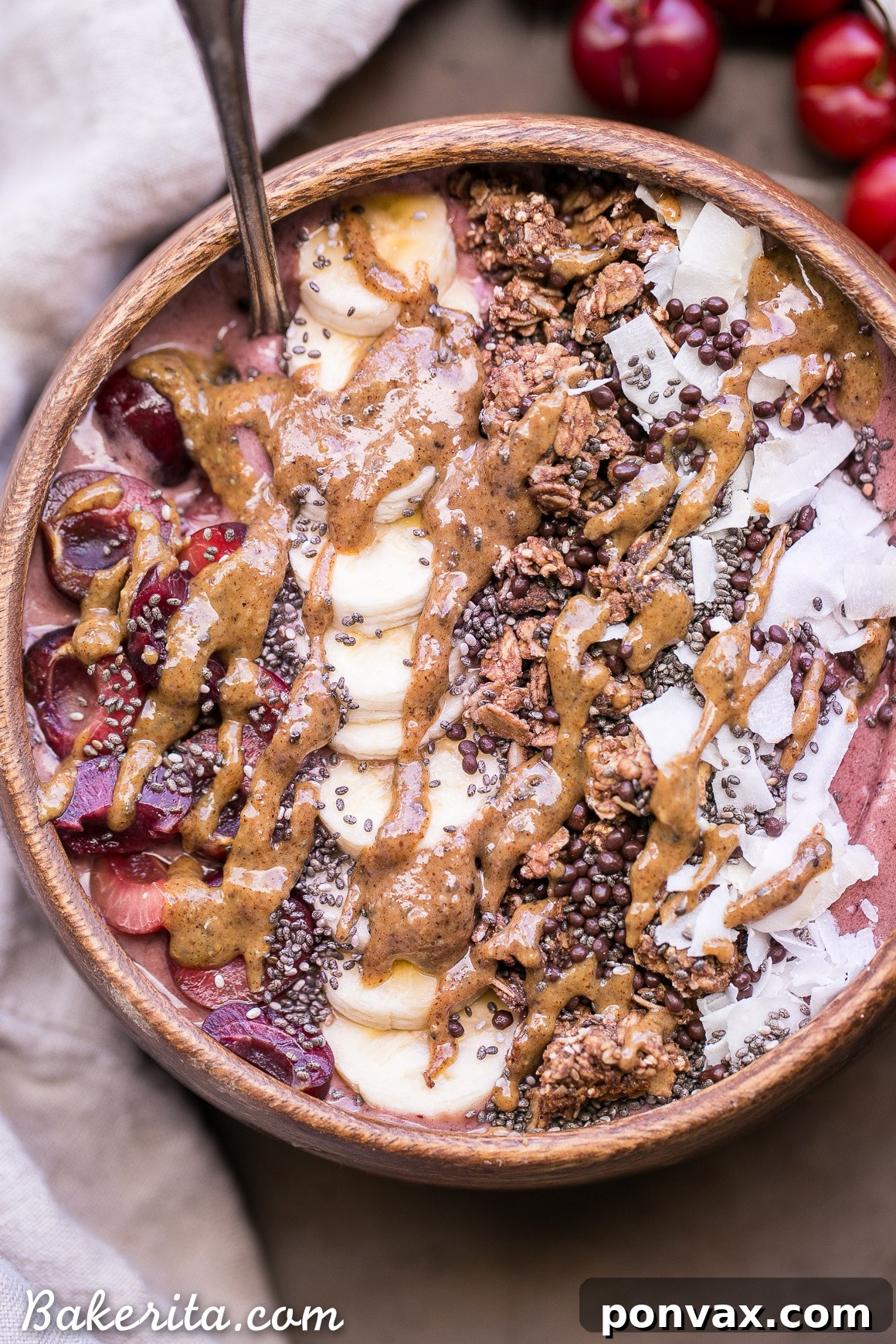 Cherry Banana Bliss Bowl 5 A spoonful of Banana Cherry Smoothie Bowl, highlighting its thick texture and the vibrant mix of ingredients