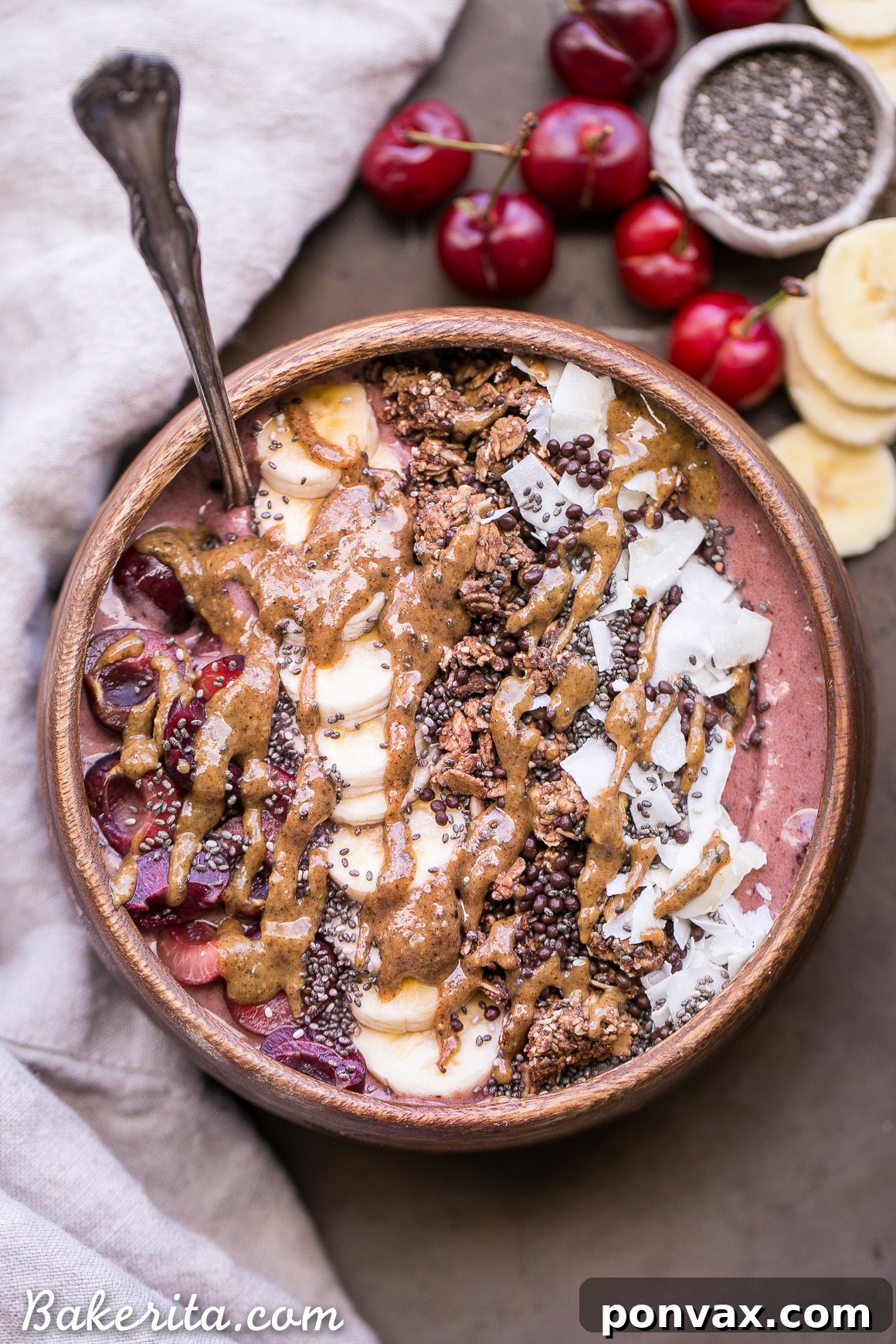 Cherry Banana Bliss Bowl 6 An overhead shot showcasing an elaborately garnished Banana Cherry Smoothie Bowl, ready to be enjoyed