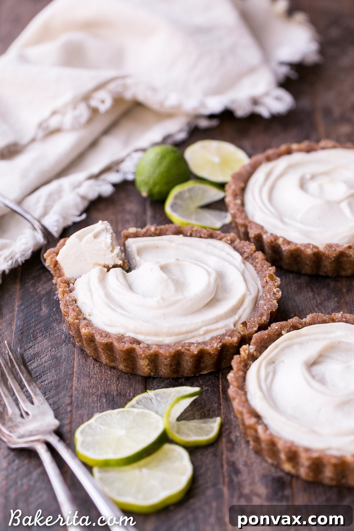 Refreshing Gluten-Free & Vegan No-Bake Lime Tarts 7 A stunning No-Bake Lime Tart garnished with fresh lime slices and mint leaves, ready to be served. A healthy, delicious, and beautiful dessert.