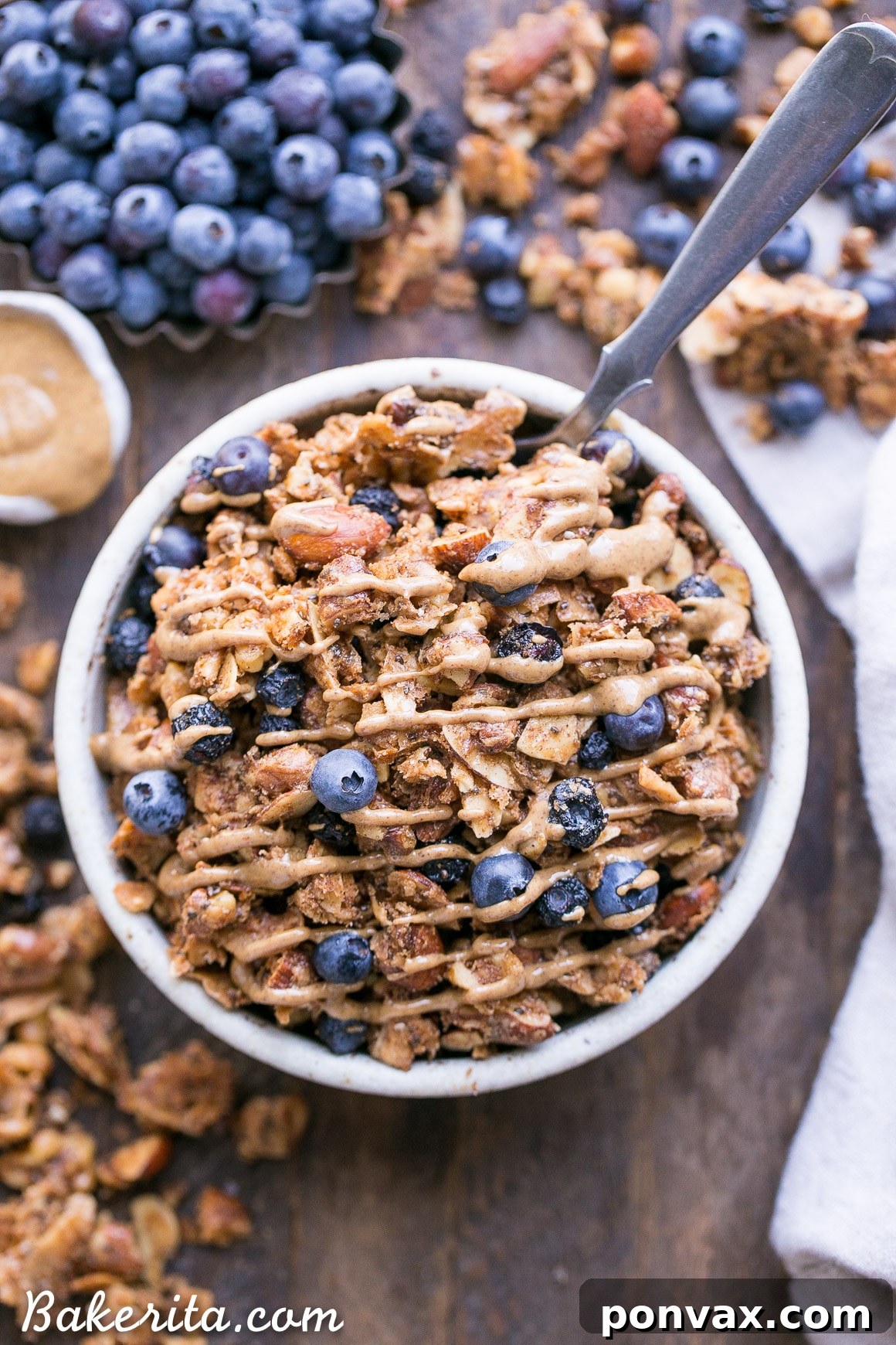 This Blueberry Almond Butter Grain-Free Granola is an easy and satisfying gluten-free, vegan and paleo granola recipe that makes the perfect breakfast or snack. It's made with simple, wholesome ingredients and is loaded with filling nuts and healthy fats to keep you satisfied.
