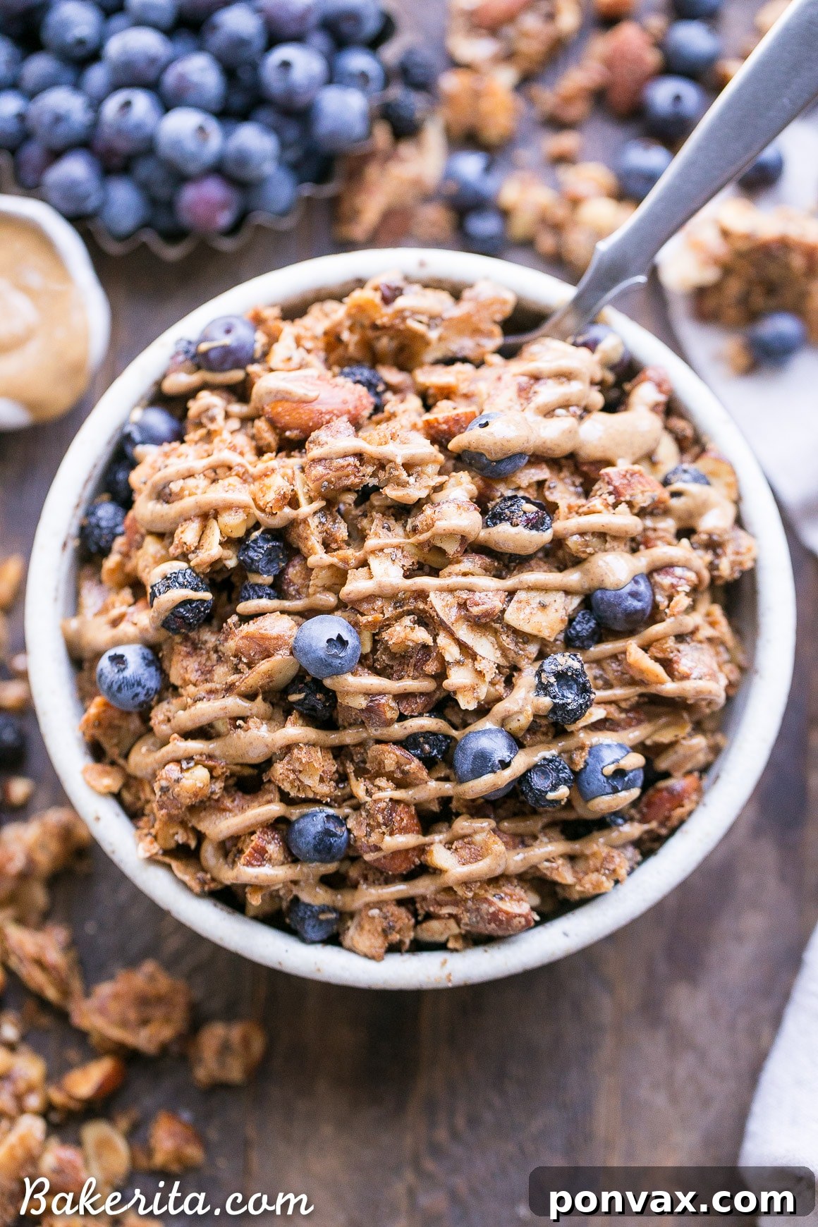 This Blueberry Almond Butter Grain-Free Granola is an easy and satisfying gluten-free, vegan and paleo granola recipe that makes the perfect breakfast or snack. It's made with simple, wholesome ingredients and is loaded with filling nuts and healthy fats to keep you satisfied.
