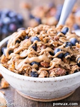 This Blueberry Almond Butter Grain-Free Granola is an easy and satisfying gluten-free, vegan and paleo granola recipe that makes the perfect breakfast or snack. It's made with simple, wholesome ingredients and is loaded with filling nuts and healthy fats to keep you satisfied.