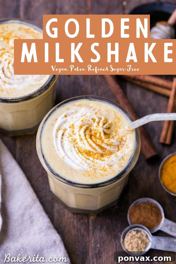 A vibrant Golden Milkshake in a glass, featuring turmeric, ginger, and other spices, perfect for a healthy and refreshing treat. Vegan, paleo, and sugar-free beverage.