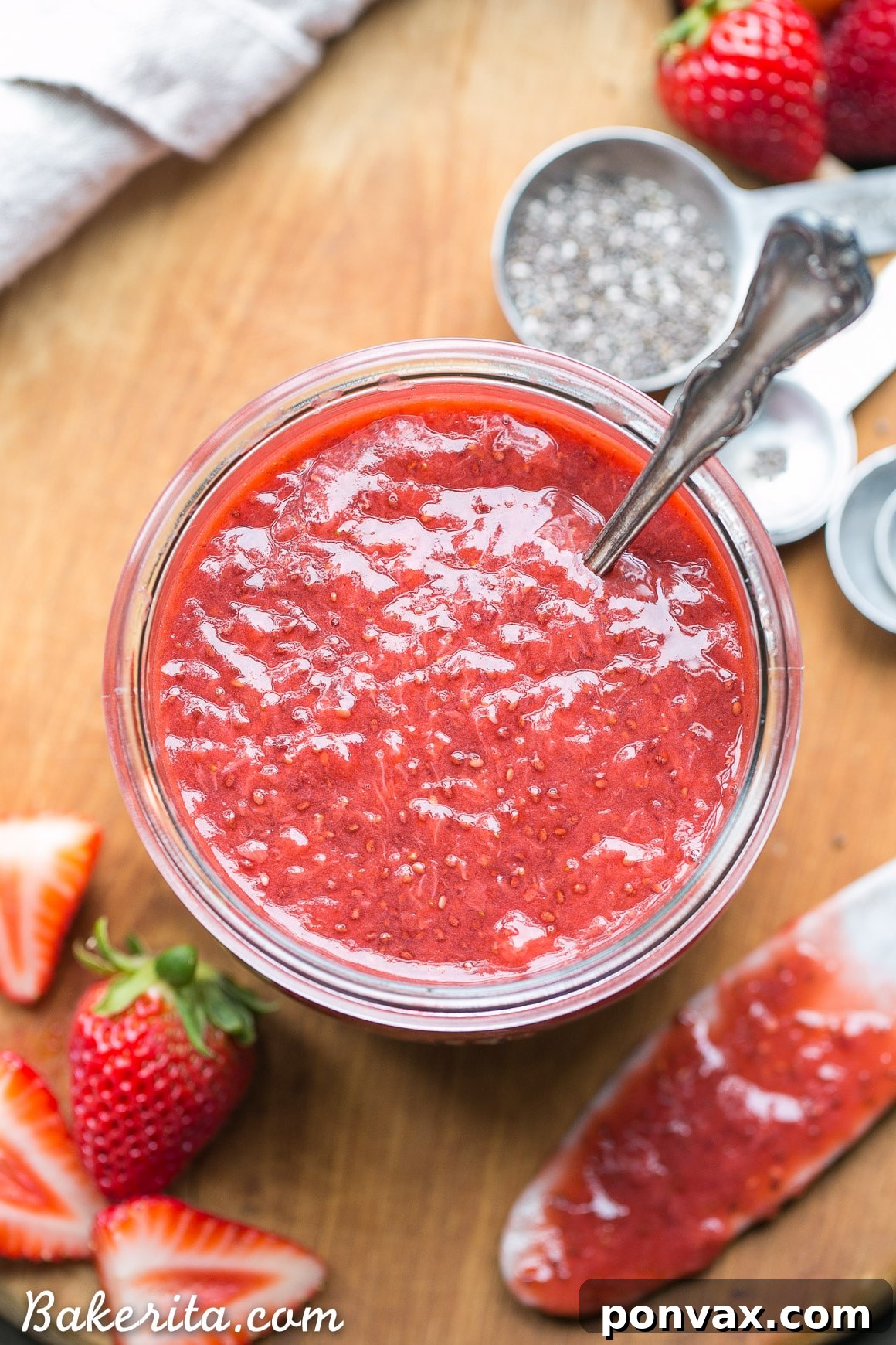 Luscious Paleo Vegan Strawberry Chia Jam 5 Close-up of a bowl filled with strawberry chia jam, highlighting its chunky fruit texture.