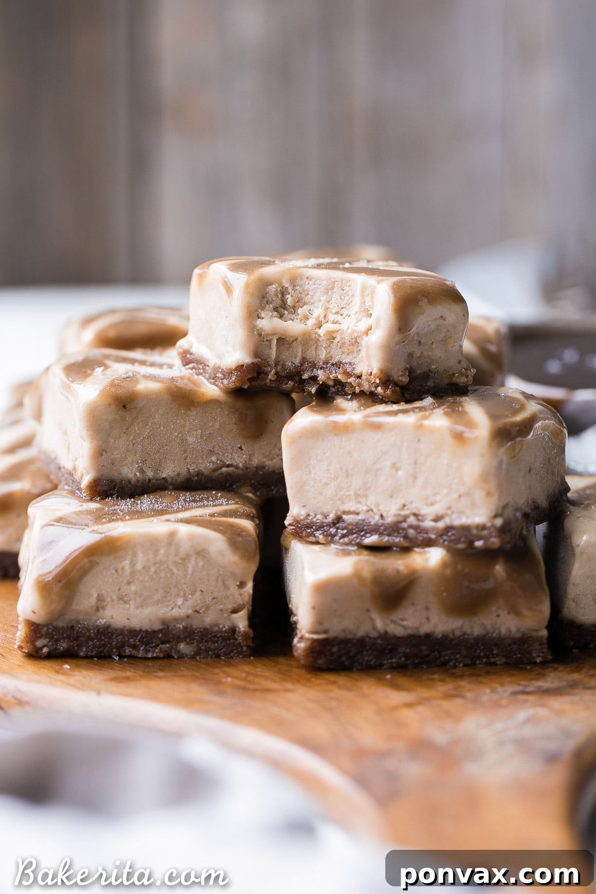 These Frozen Caramel Banana Bars are easy to make in a blender or food processor, and they're super creamy and refreshing. These gluten-free and paleo bars have a chewy pecan-date crust, topped with banana nice cream and a caramel swirl.