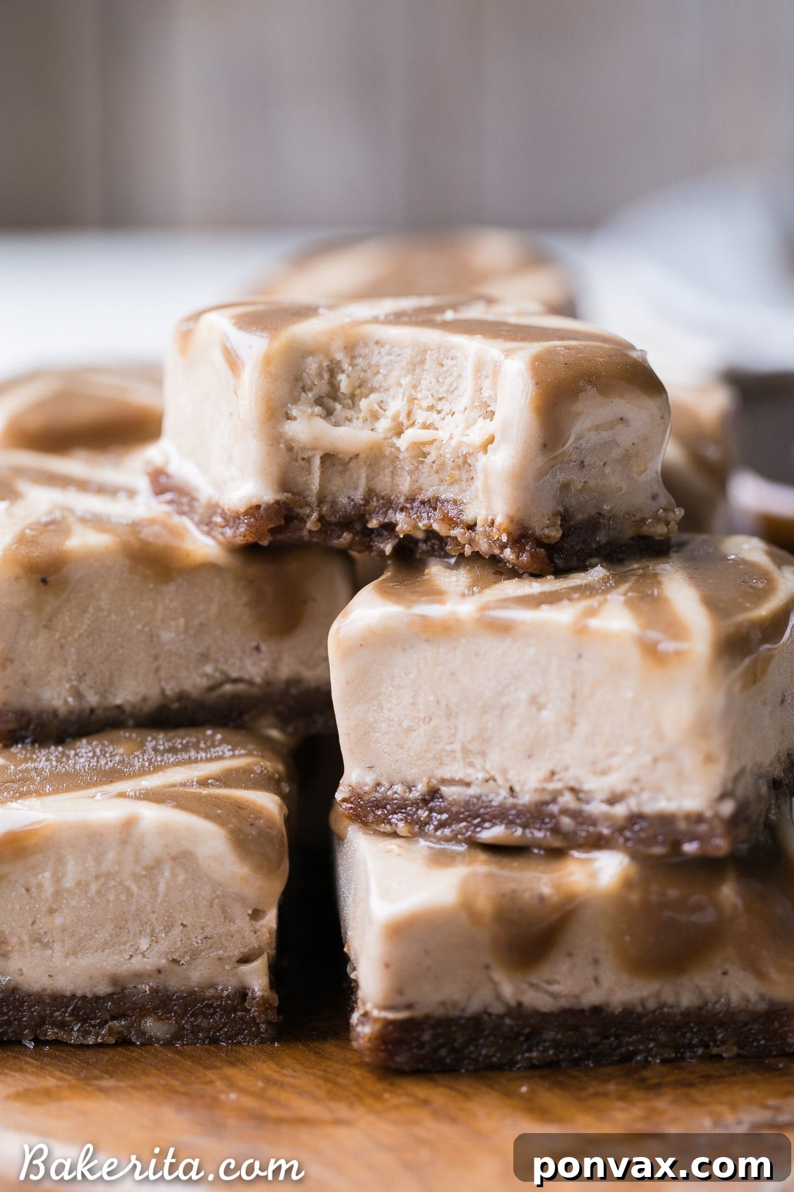 These Frozen Caramel Banana Bars are easy to make in a blender or food processor, and they're super creamy and refreshing. These gluten-free and paleo bars have a chewy pecan-date crust, topped with banana nice cream and a caramel swirl.
