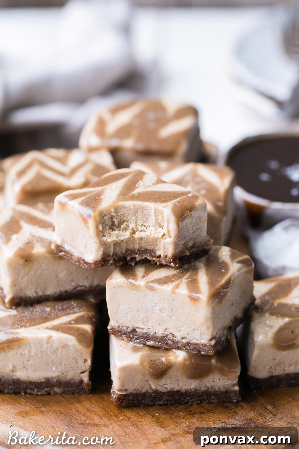 These Frozen Caramel Banana Bars are easy to make in a blender or food processor, and they're super creamy and refreshing. These gluten-free and paleo bars have a chewy pecan-date crust, topped with banana nice cream and a caramel swirl.