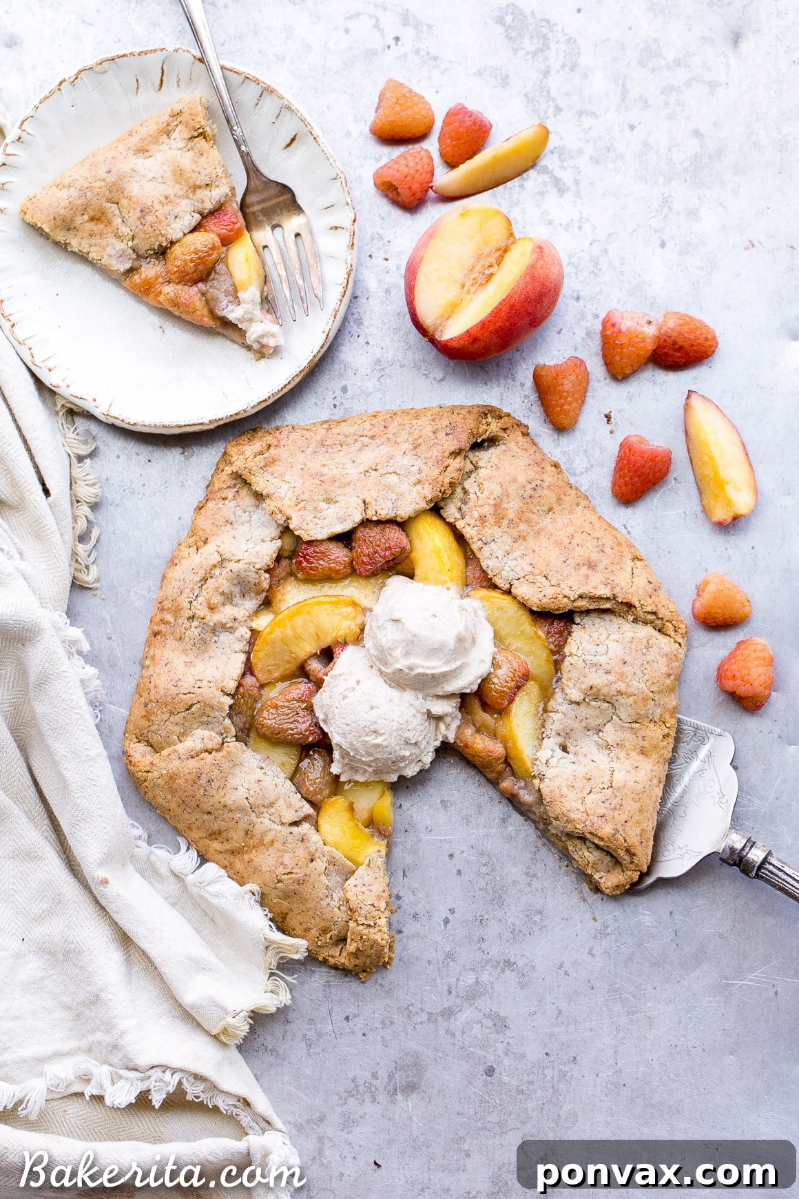 A close-up shot of the fresh peach and raspberry filling mixture in a bowl, showing the light coating of maple syrup and tapioca starch.