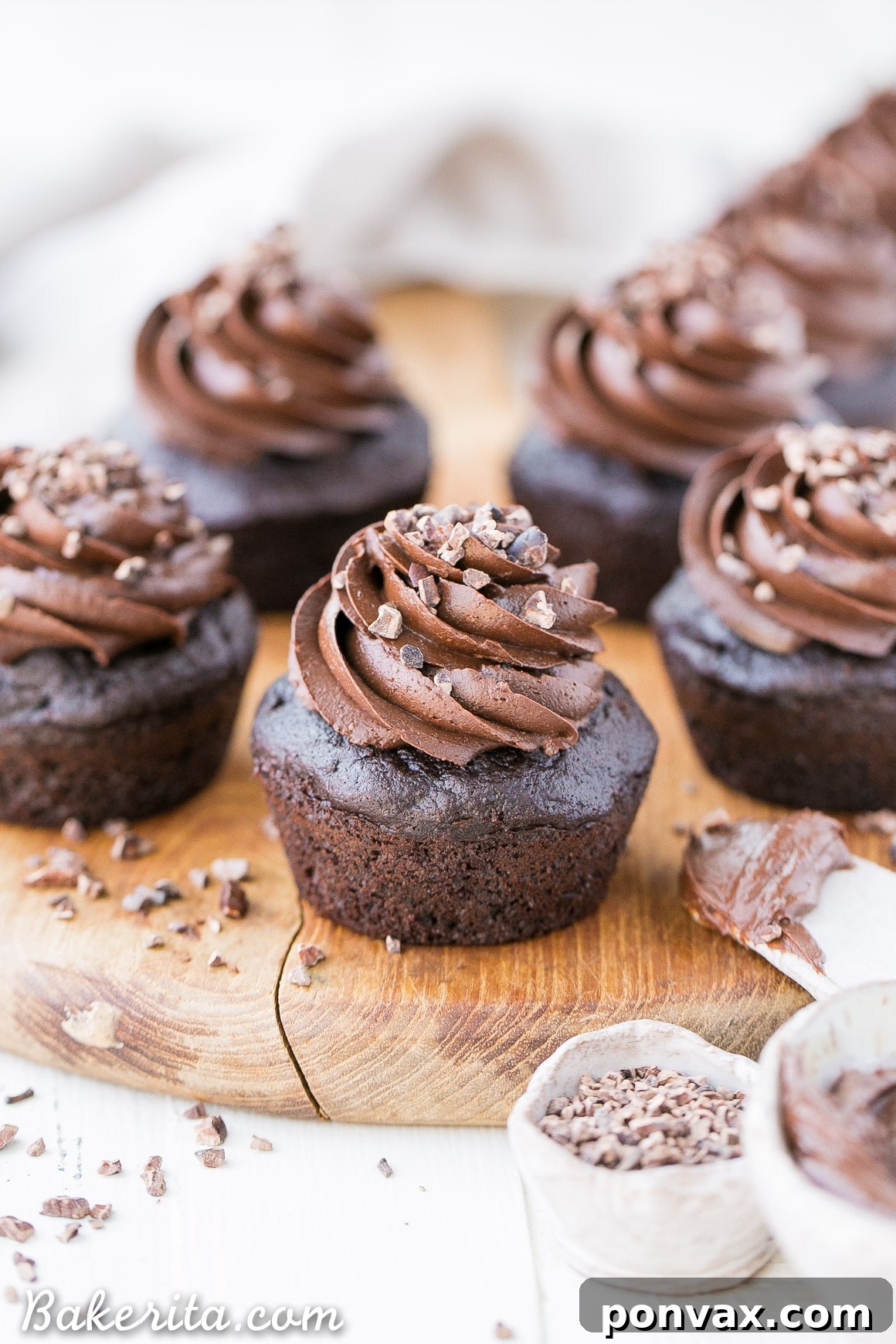 Super moist and fudgy Gluten-Free Chocolate Zucchini Cupcakes with a rich Paleo Chocolate Frosting. You won't taste the zucchini!