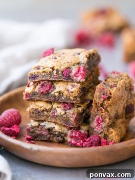 A delicious square of Gluten-Free Raspberry Blondie ready to eat.