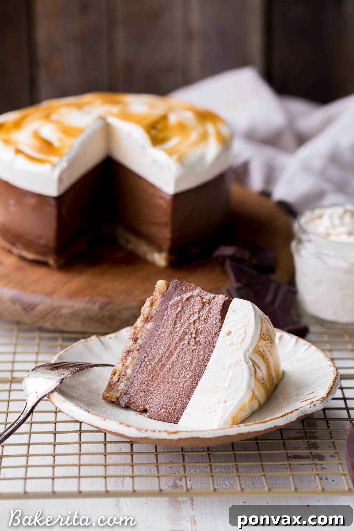 A close-up of the No Bake S'mores Cheesecake crust before the filling is added, showcasing its textured, graham cracker-like appearance. It's a gluten-free and Paleo base for this dairy-free dessert.