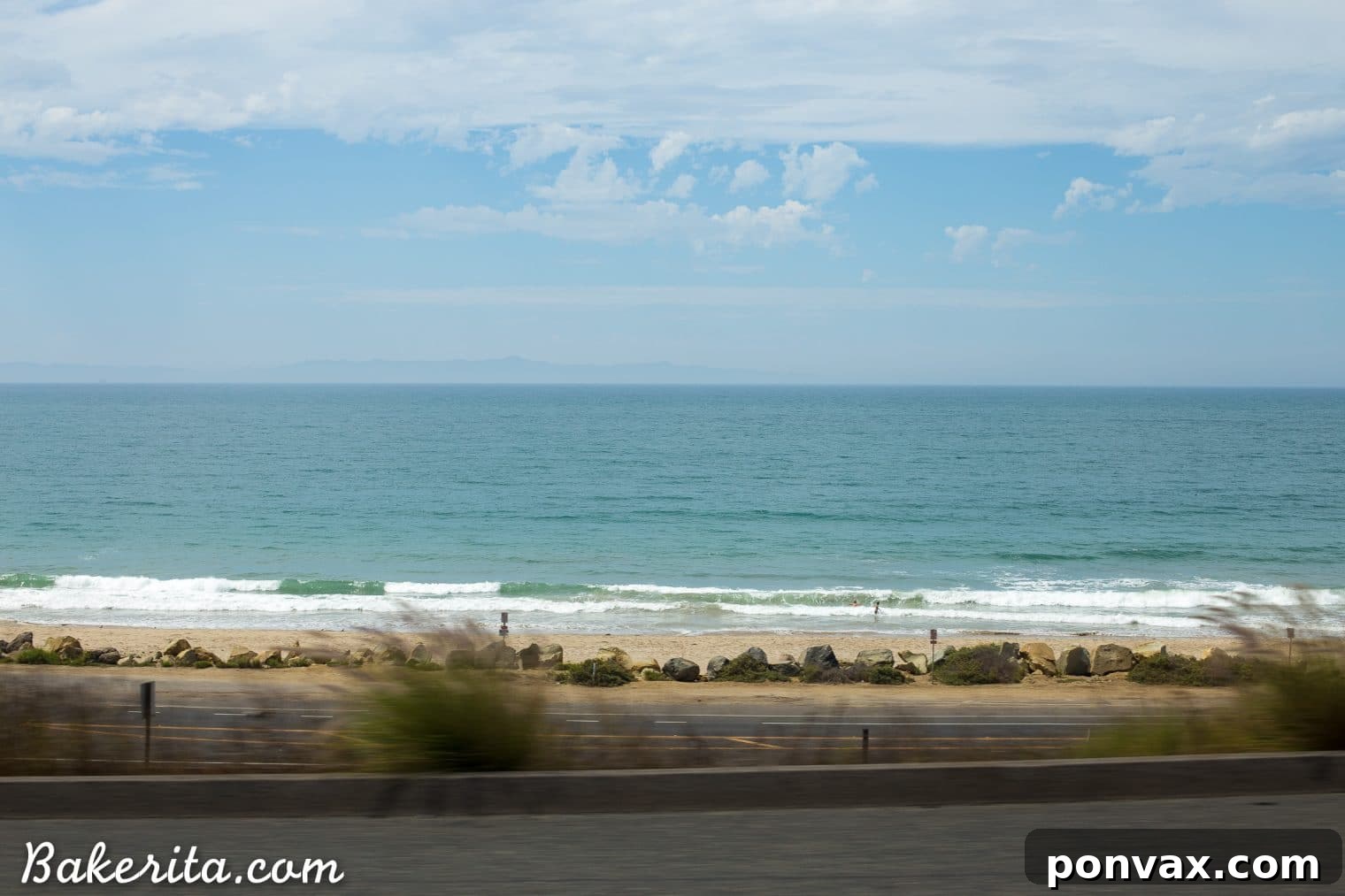 Santa Barbara RV Adventure with a Refreshing Peach Tomato Salad 31 A picturesque view of the Santa Barbara coastline with a road winding along it, symbolizing travel and adventure by RV.