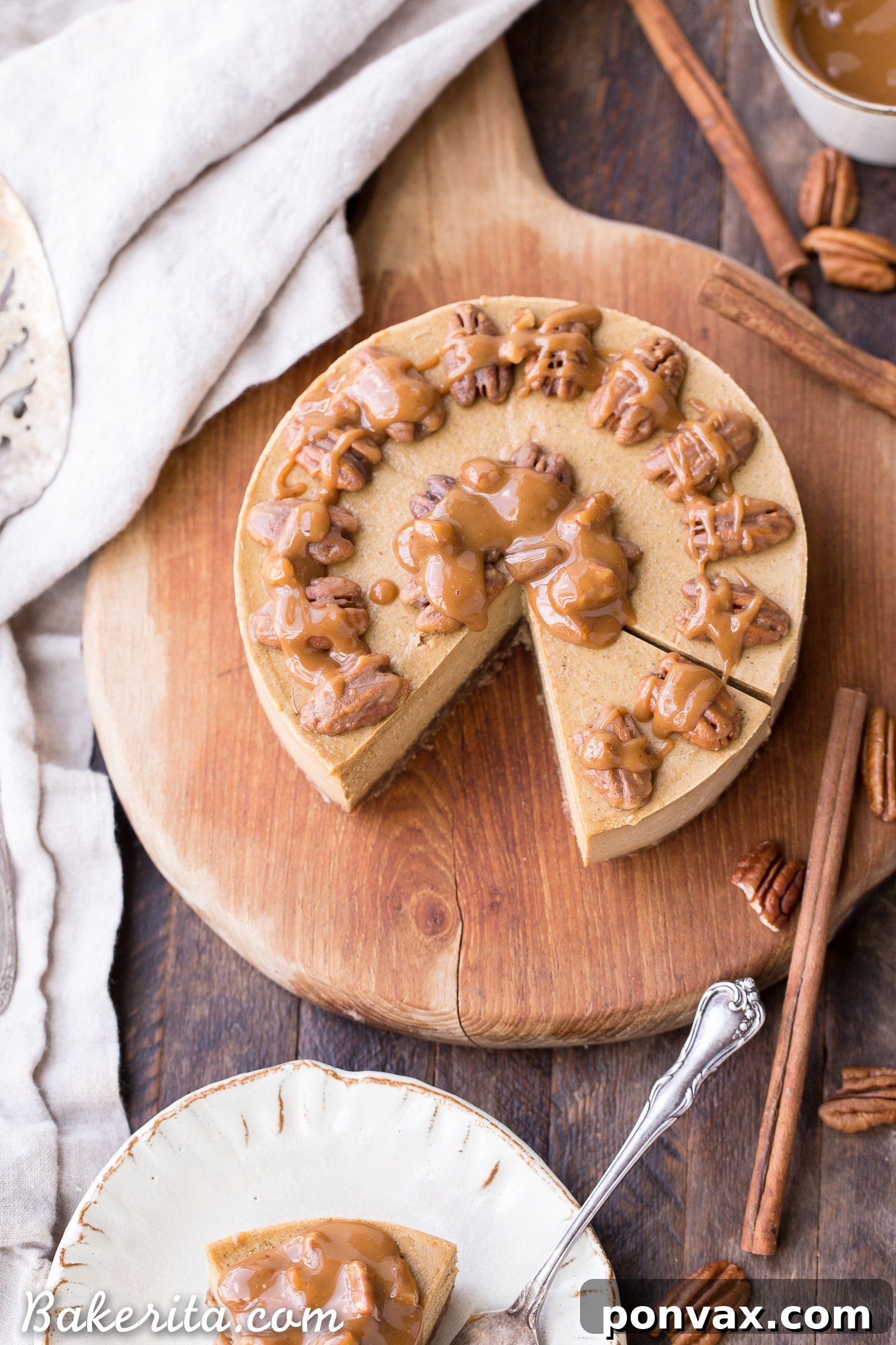 This No Bake Pumpkin Cheesecake is super creamy with a pecan crust and a spiced pumpkin cheesecake filling that's made with cashews! This healthier pumpkin cheesecake is gluten-free, dairy-free, paleo + vegan, and absolutely perfect for the holidays.