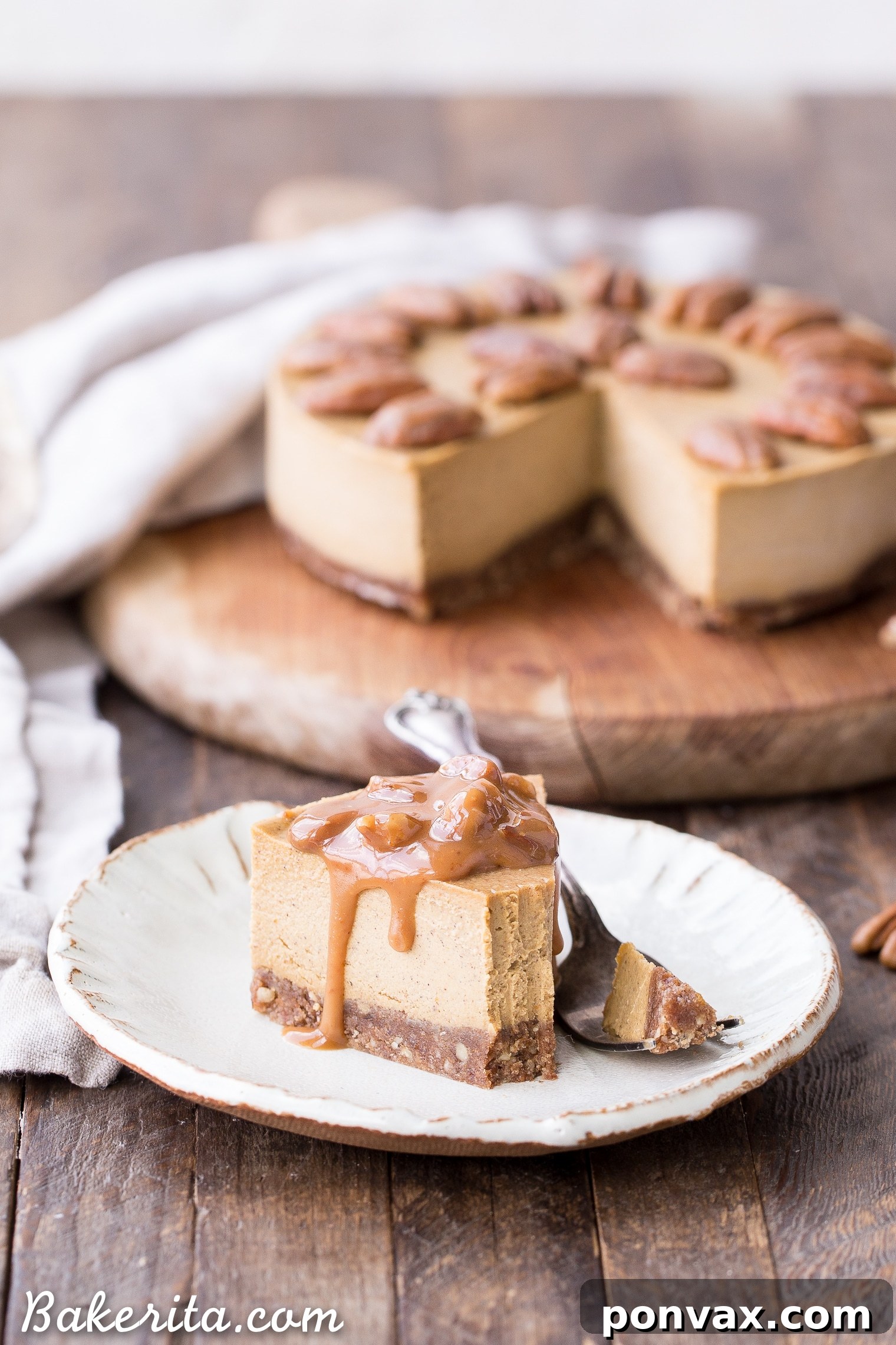 This No Bake Pumpkin Cheesecake is super creamy with a pecan crust and a spiced pumpkin cheesecake filling that's made with cashews! This healthier pumpkin cheesecake is gluten-free, dairy-free, paleo + vegan, and absolutely perfect for the holidays.