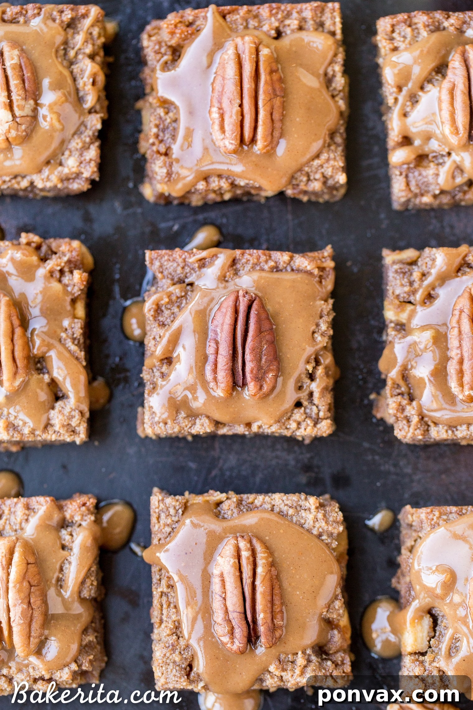 Close-up of Apple Blondies with a thick, glossy caramel glaze and a whole pecan garnish.