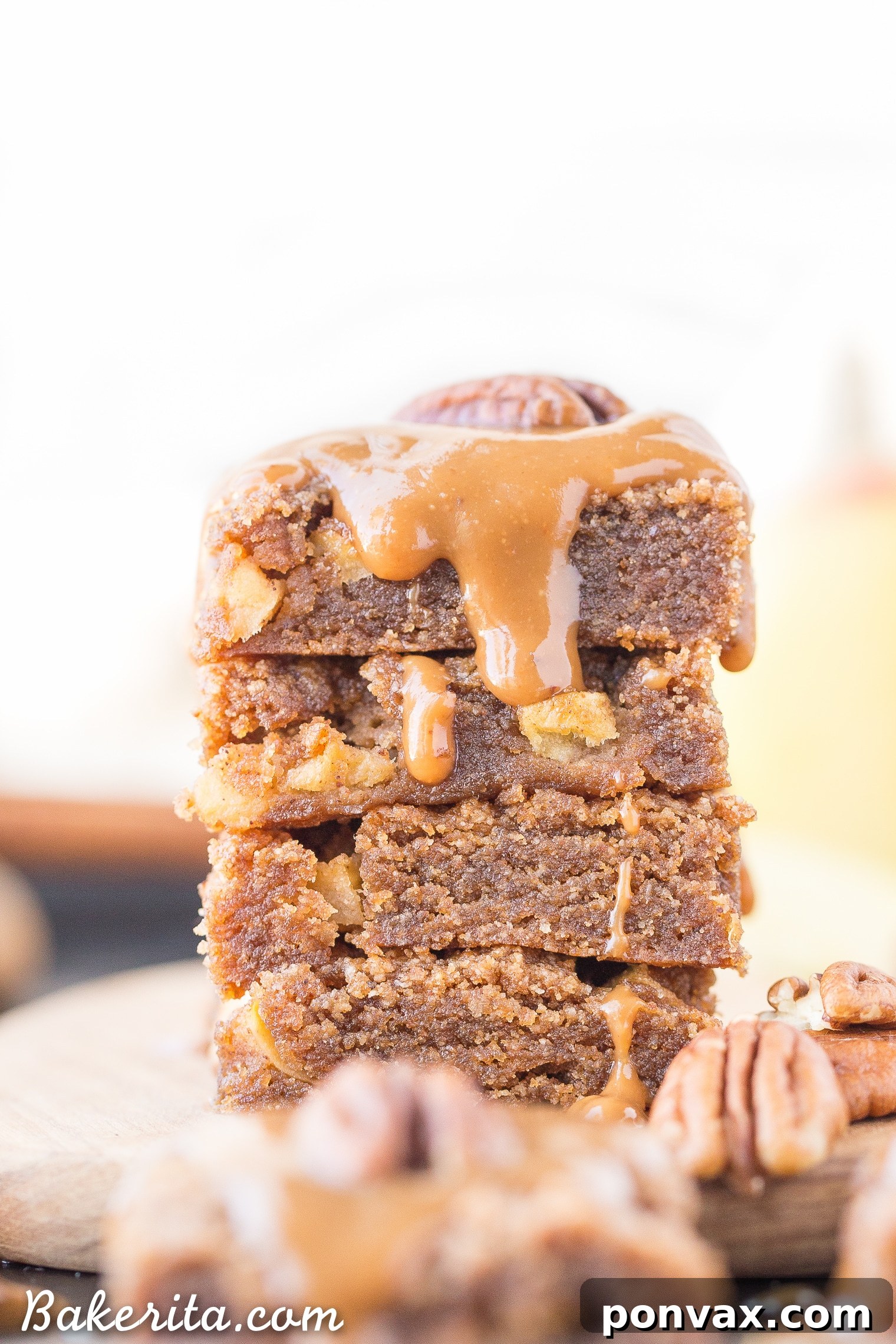 Stacked Apple Blondies showing the layers of blondie, caramel glaze, and pecan.