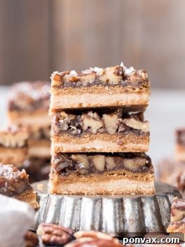 Thick and caramelly Pecan Pie Bars with a crispy coconut flour shortbread crust and gooey pecan filling. Gluten-free, paleo, and vegan, perfect for dessert spreads.