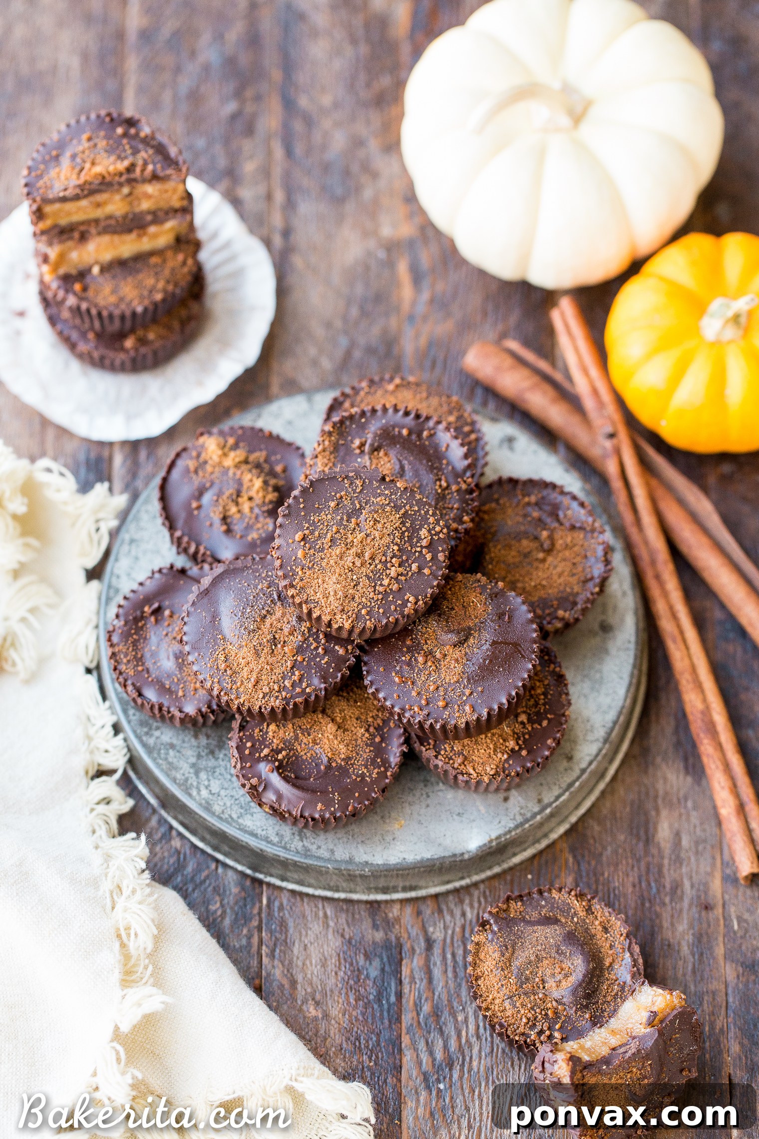 A close-up of Chocolate Pumpkin Spice Cups showcasing the rich chocolate shell and vibrant pumpkin filling.