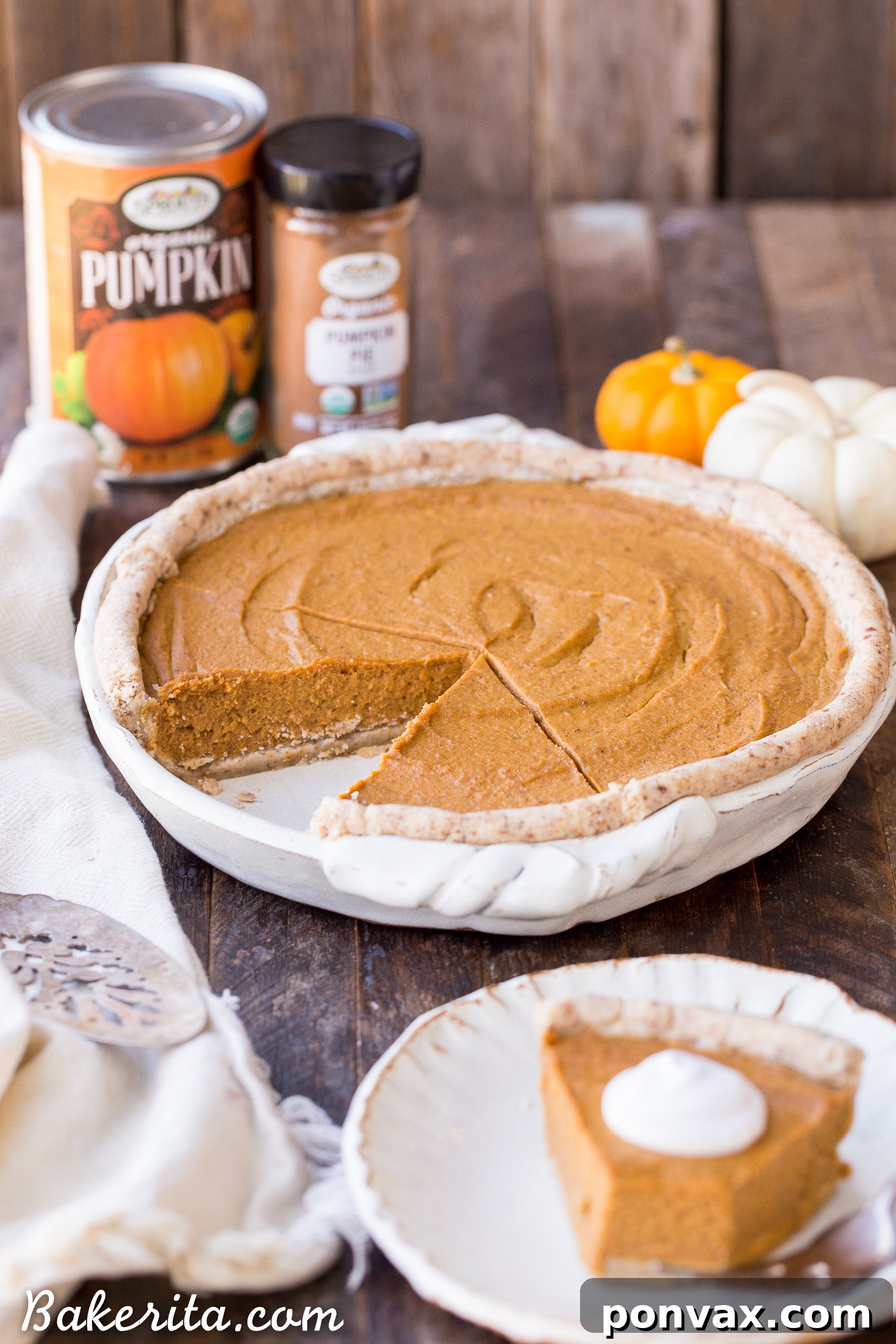 Silky Smooth Vegan Pumpkin Pie Bliss 5 A slice of Paleo and Vegan Pumpkin Pie being lifted, highlighting the creamy texture of the filling and the crispness of the gluten-free crust.