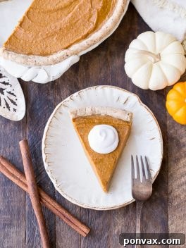 Perfectly baked Paleo and Vegan Pumpkin Pie, showcasing its creamy filling and flaky crust.