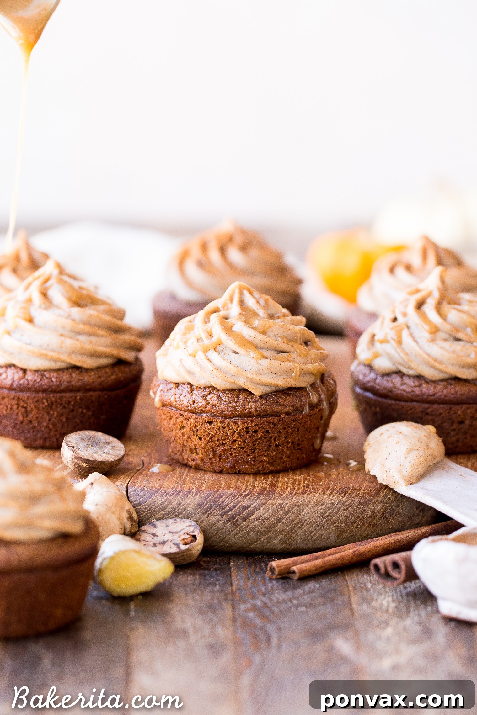 A beautifully frosted Gluten-Free Pumpkin Chai Cupcake on a serving plate