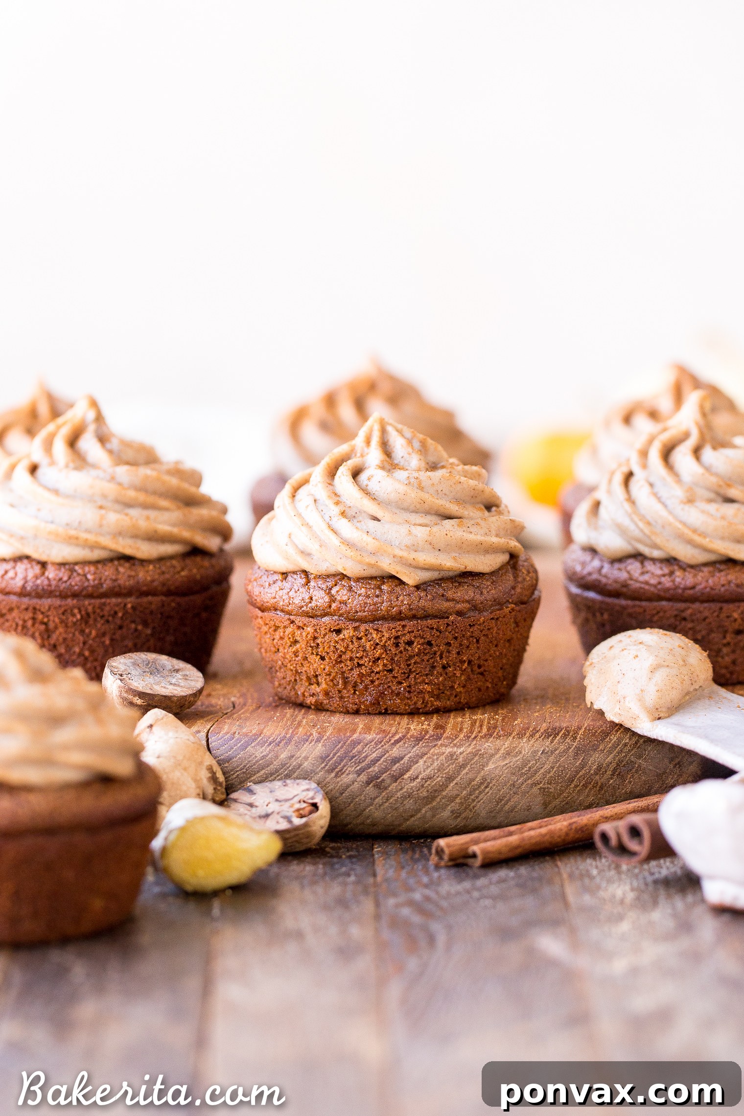 A spread of Gluten-Free Pumpkin Chai Cupcakes, beautifully frosted and ready to serve