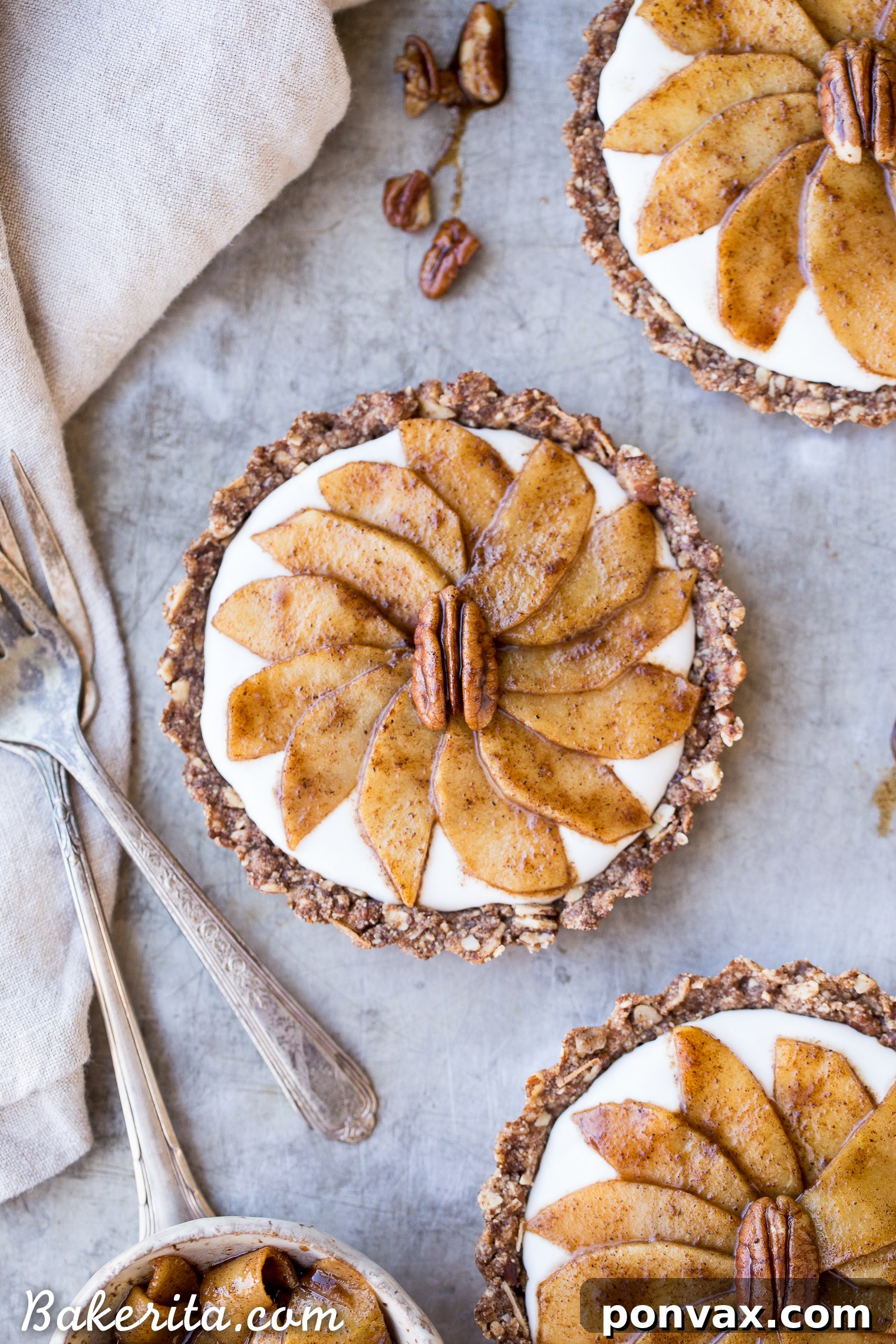 A selection of individual Granola Breakfast Tart crusts, golden and ready for filling, promising a delicious gluten-free and paleo base for your morning meal.