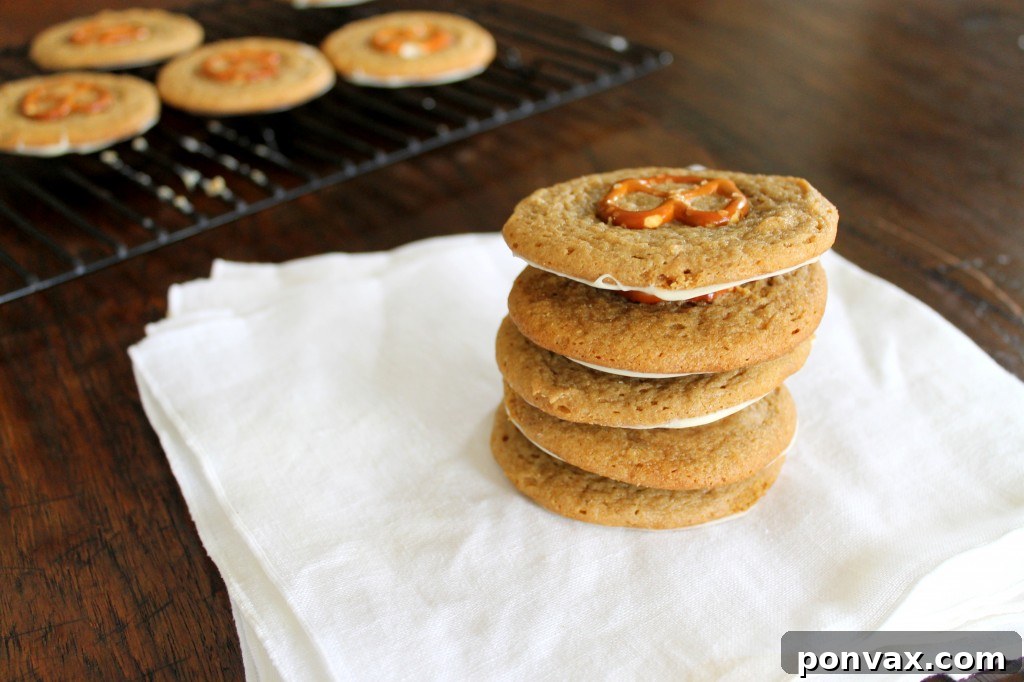 Close-up of a White Chocolate Pretzel Peanut Butter Cookie, showcasing the pretzel and white chocolate drizzle