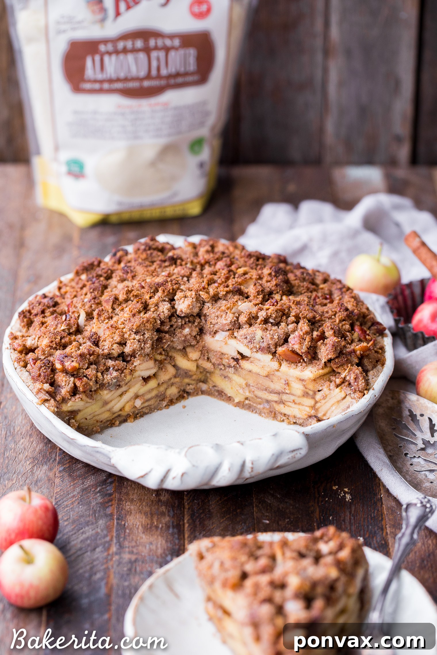 This Apple Crumble Pie is so delicious it's bound to be a holiday dessert staple! This gluten free, paleo + vegan pie is filled with soft, caramelized apples and topped with a nutty, crunchy paleo crumble topping.