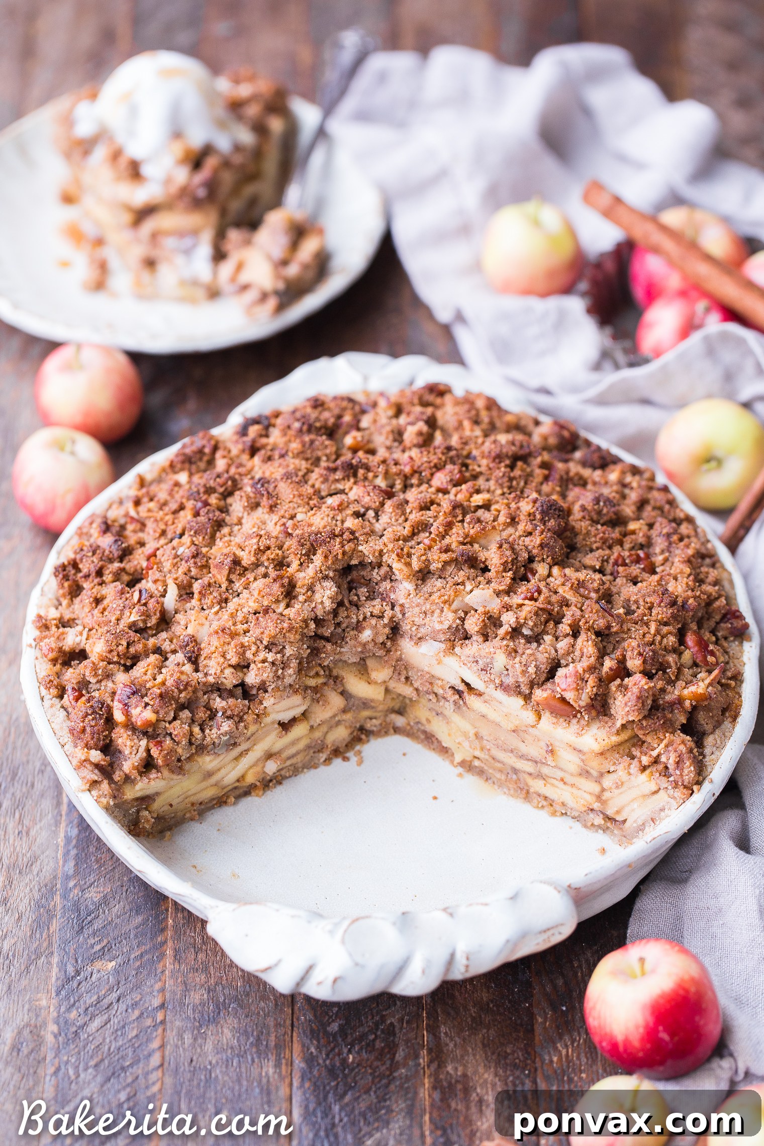 This Apple Crumble Pie is so delicious it's bound to be a holiday dessert staple! This gluten free, paleo + vegan pie is filled with soft, caramelized apples and topped with a nutty, crunchy paleo crumble topping.