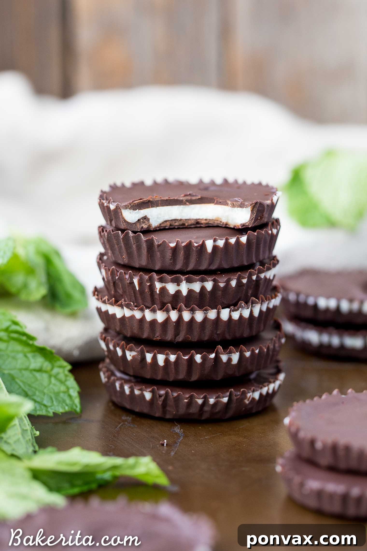 A close-up of the smooth and creamy peppermint filling within a chocolate cup.