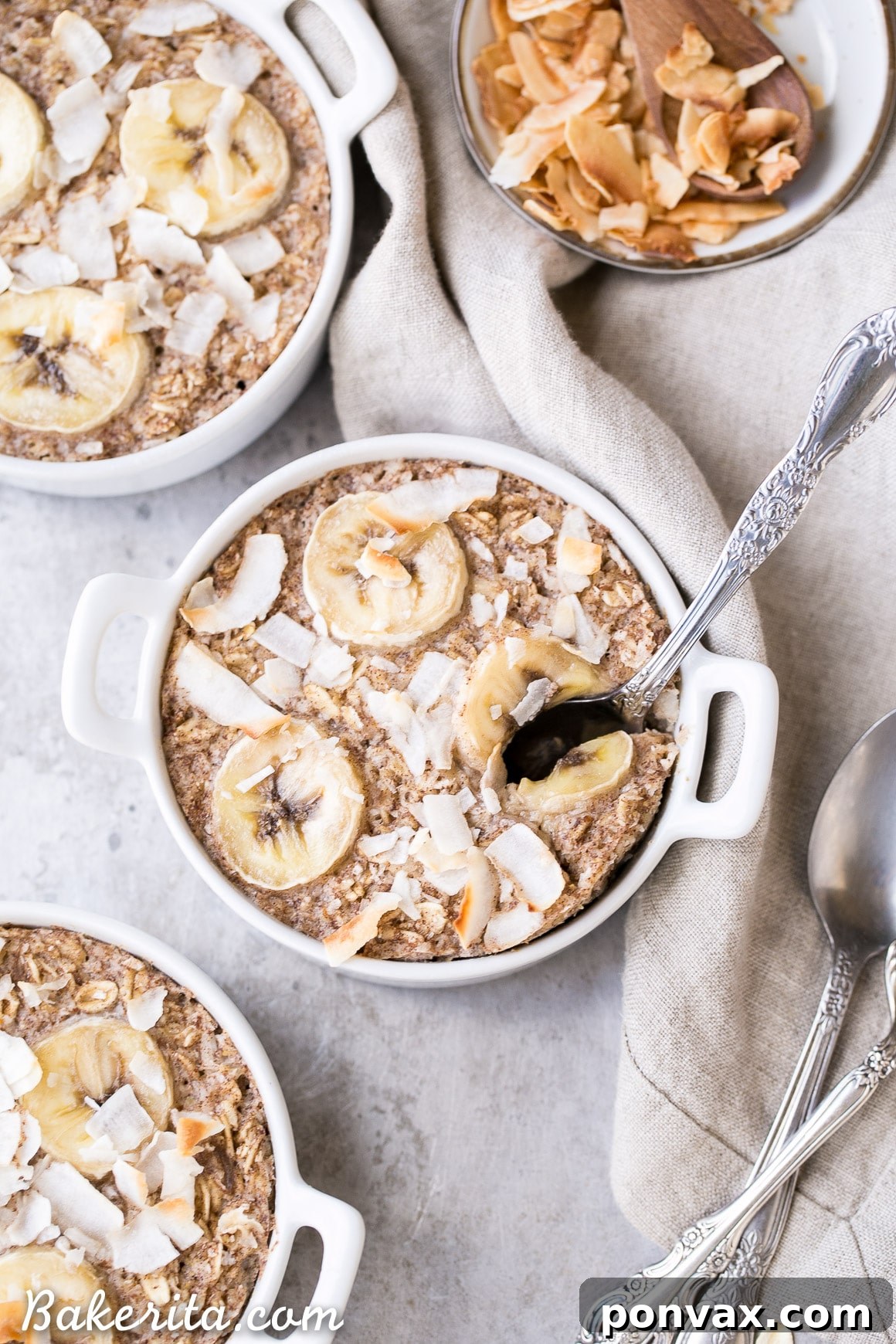 A close-up of a spoonful of Banana Coconut Baked Oatmeal, ready to be eaten, showcasing its texture and deliciousness.