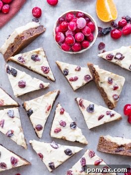 These Homemade Cranberry Bliss Bars are a homemade take on the Starbucks' holiday favorite! These cakey blondies are chewy and loaded with cranberry, orange, and white chocolate flavors. They're gluten free, paleo and vegan.