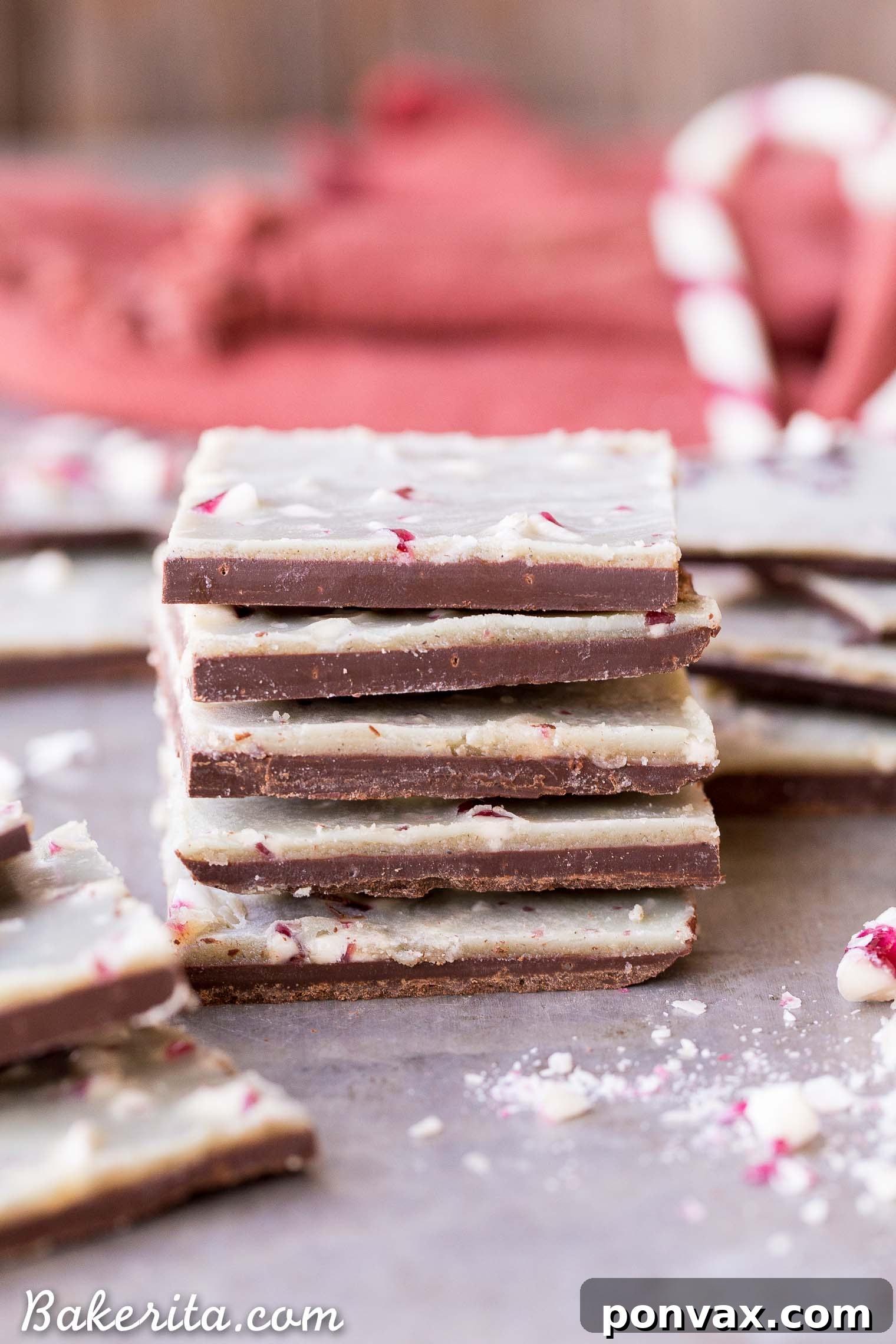 A festive display of finished Vegan Chocolate Peppermint Bark, broken into delicious pieces and garnished with additional crushed peppermint. This healthier, homemade holiday treat is ready to be shared or enjoyed.