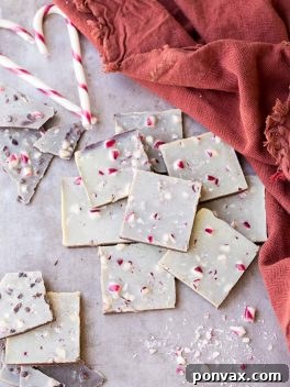 This Chocolate Peppermint Bark is a healthier twist on the holiday classic! It has a layer of dark chocolate topped with minty homemade vegan white chocolate and a sprinkling of crushed peppermint candies. You'll adore this gluten-free, paleo and vegan peppermint bark!