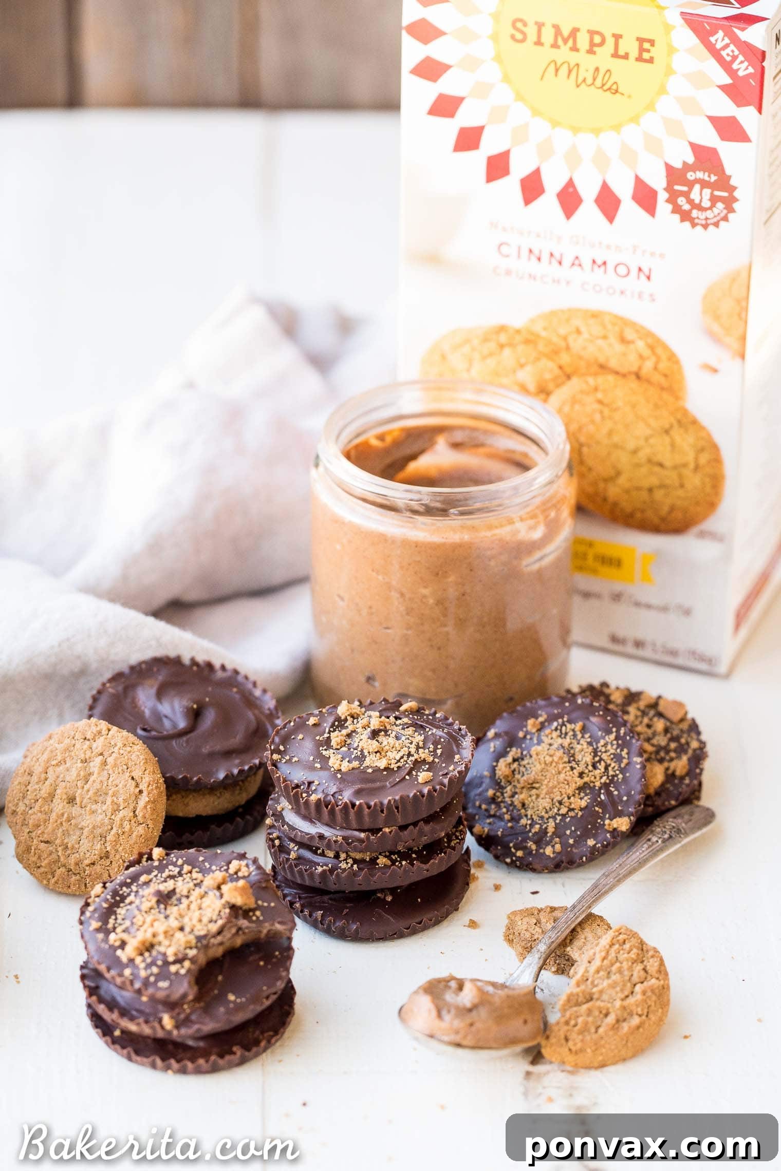 Rich Gluten Free Paleo Vegan Chocolate Cookie Butter Cups 4 Ingredients for homemade cookie butter laid out, including Simple Mills Cinnamon Crunchy Cookies, maple syrup, and coconut oil.