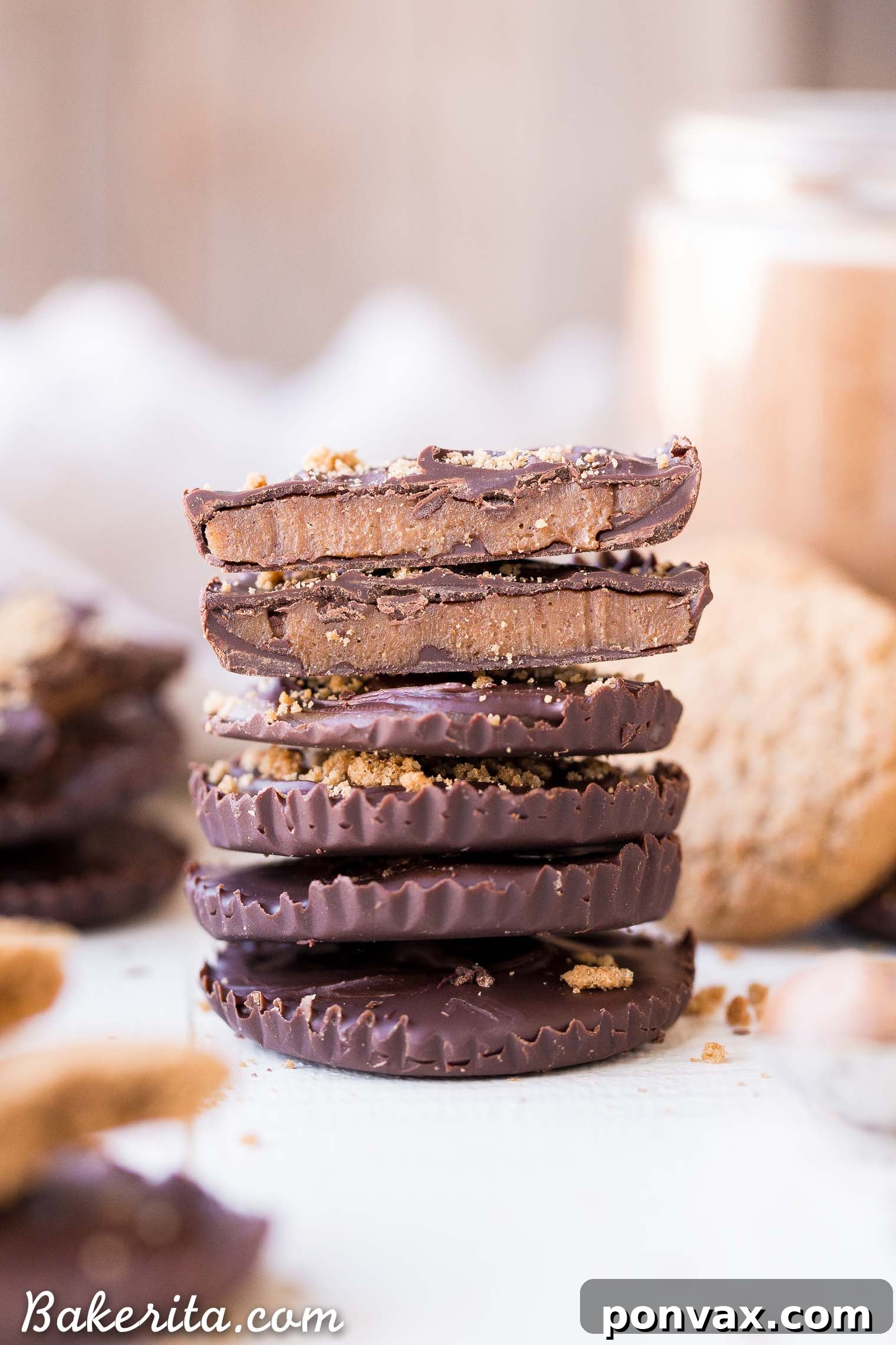 Rich Gluten Free Paleo Vegan Chocolate Cookie Butter Cups 6 Partially assembled Chocolate Cookie Butter Cups with a layer of chocolate and a spoonful of homemade cookie butter.