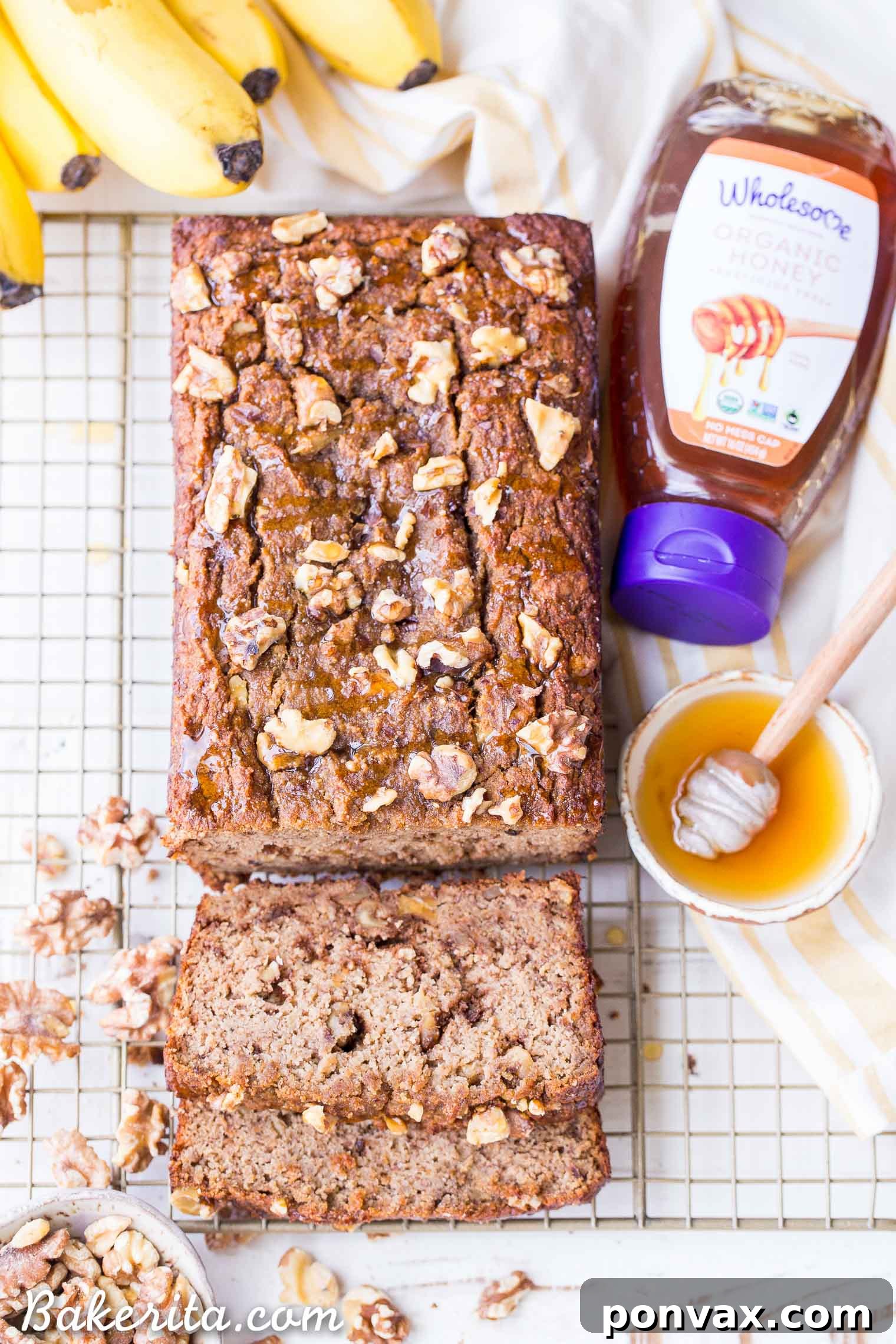 Paleo Golden Honey Nut Banana Loaf 4 Close-up of Paleo Honey Nut Banana Bread, showcasing its moist texture and walnuts throughout.