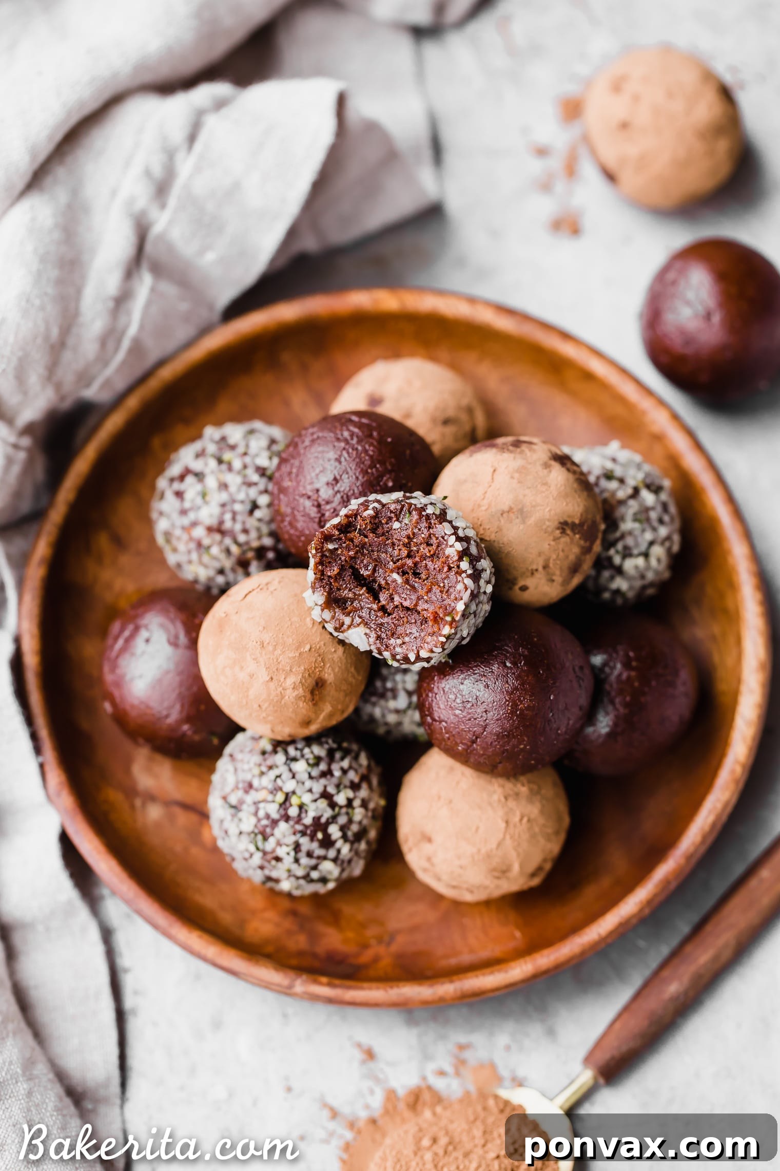 Hand-rolled Raw Chocolate Truffles, showcasing their dark chocolate coating and rustic appeal. Easy, healthy, and satisfying.