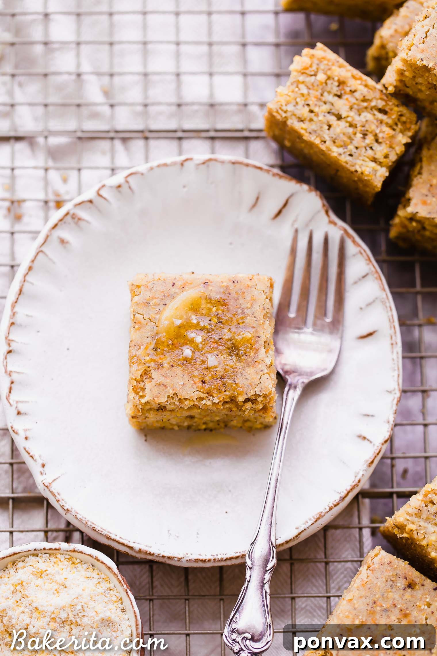 This Gluten Free + Vegan Cornbread is fluffy and light with an amazing texture from the cornmeal! It's perfect served with soup or chili, served as a side or snack, or just topped with a little bit of butter or spread.